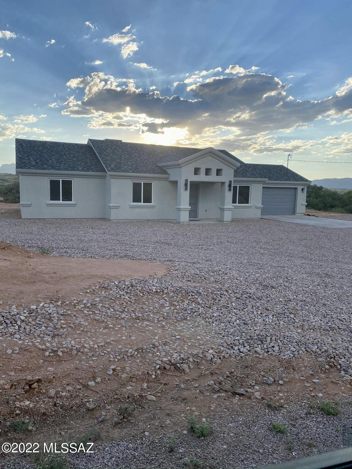 Built in 2020, this impeccable ranch style home is situated on a peaceful, corner lot with amazing views!  Just minutes from Pena Blanca Lake and the freeway.