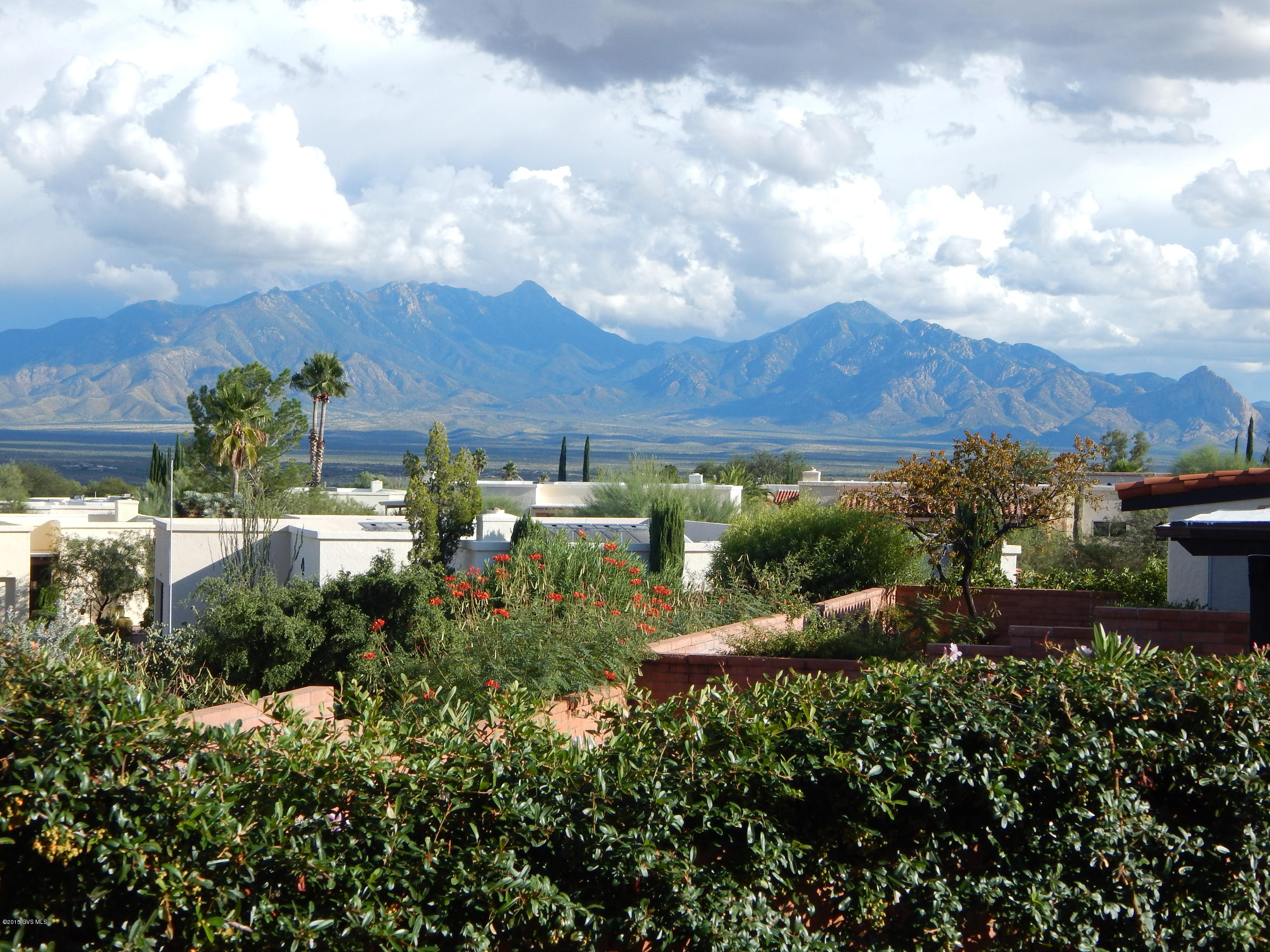 This is a spacious home on a gorgeous corner lot with terrific mountain views from the back patio. The living room is open to the dining area and den providing a roomy and welcoming feel. The living room has a desirable beehive fireplace with ample space for relaxing or entertaining. The windows and skylights allow light to stream into the space adding warmth to the home. The kitchen leads to the back patio where you can enjoy your morning paper and the terrific Santa Rita Mountains views. This is a well cared for home located in the popular and centrally located community of Continental Vistas. Some furniture items are available for purchase via SBOS.