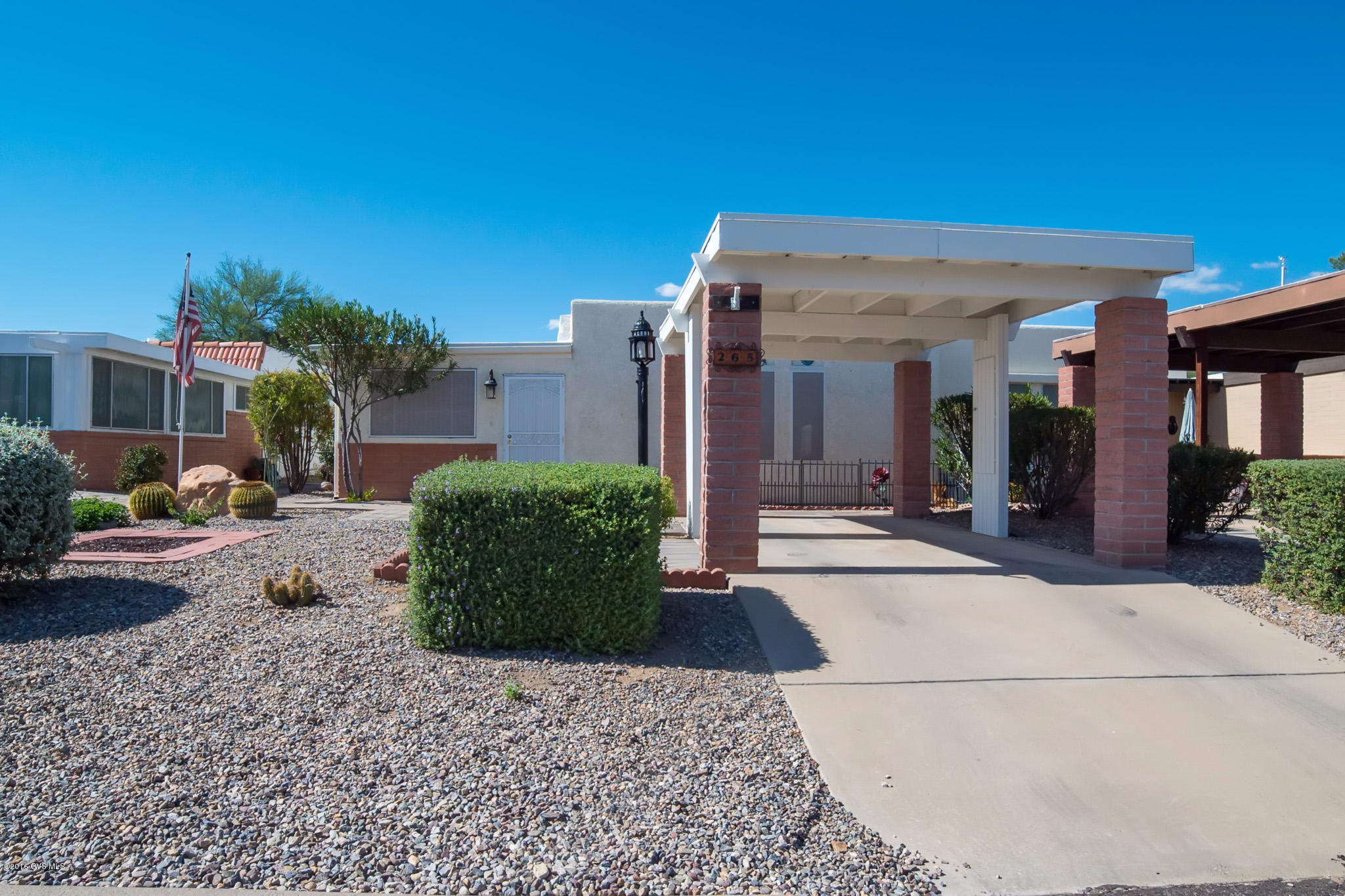 Very spacious townhome located in a central location in Green Valley near shopping, churches, restaurants and recreation centers. This home has been enlarged by adding a large studio/office/den on the south side of the home. The kitchen has been remodeled and has beautiful cabinets and granite countertops. Great for year round living or winter rental. Lovely desert plantings in common area behind the home. Just a short distance from the HOA community pool too!