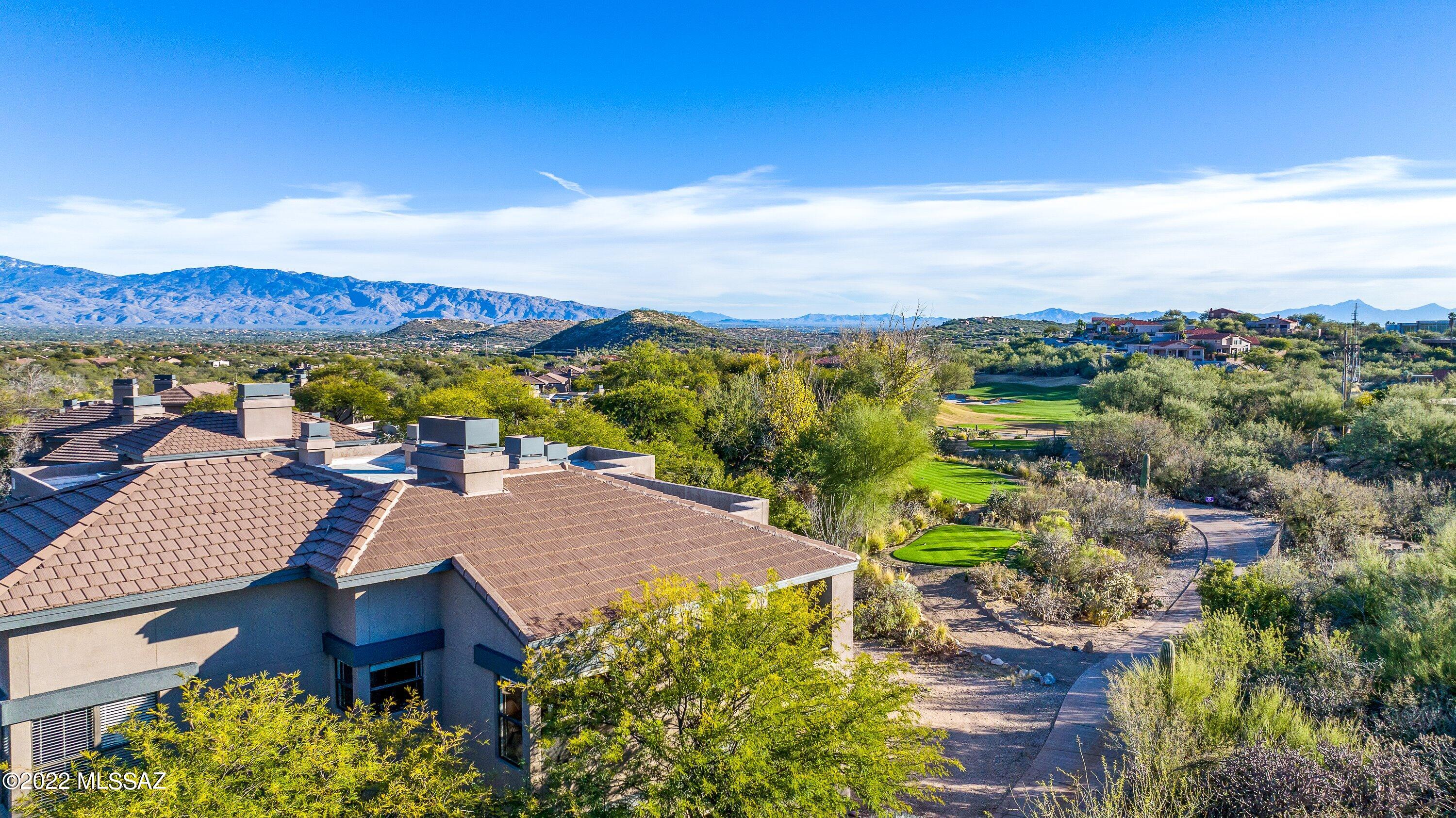 Stunning & impeccable 3 Bd 2 Ba luxury condo w/ mountain views from almost every room, L-shaped private patio and front patio.  Sunset and 15th tee box views also from the L-Shaped private patio.  This exceptional condo offers soaring 10' ceilings, an abundance of natural light, all ceramic tile throughout, new AC unit and remodeled 2nd bath. The kitchen boasts beautiful granite countertops, SS appliances, soft close cabinets/drawers with lower pullouts & dimmable led lighting.  Split bedroom floor plan and sliding barn door allows your guests to have their own private retreat from the living area. There is just so much to enjoy here, see you soon! Amenities: 3 sparkling pools, clubhouse and gym. Located in the award winning District 16 schools, upscale shopping, dining are in walking distance and just minutes away!   For the outdoor enthusiasts, Sabino Canyon recreation is less than 2 miles away.