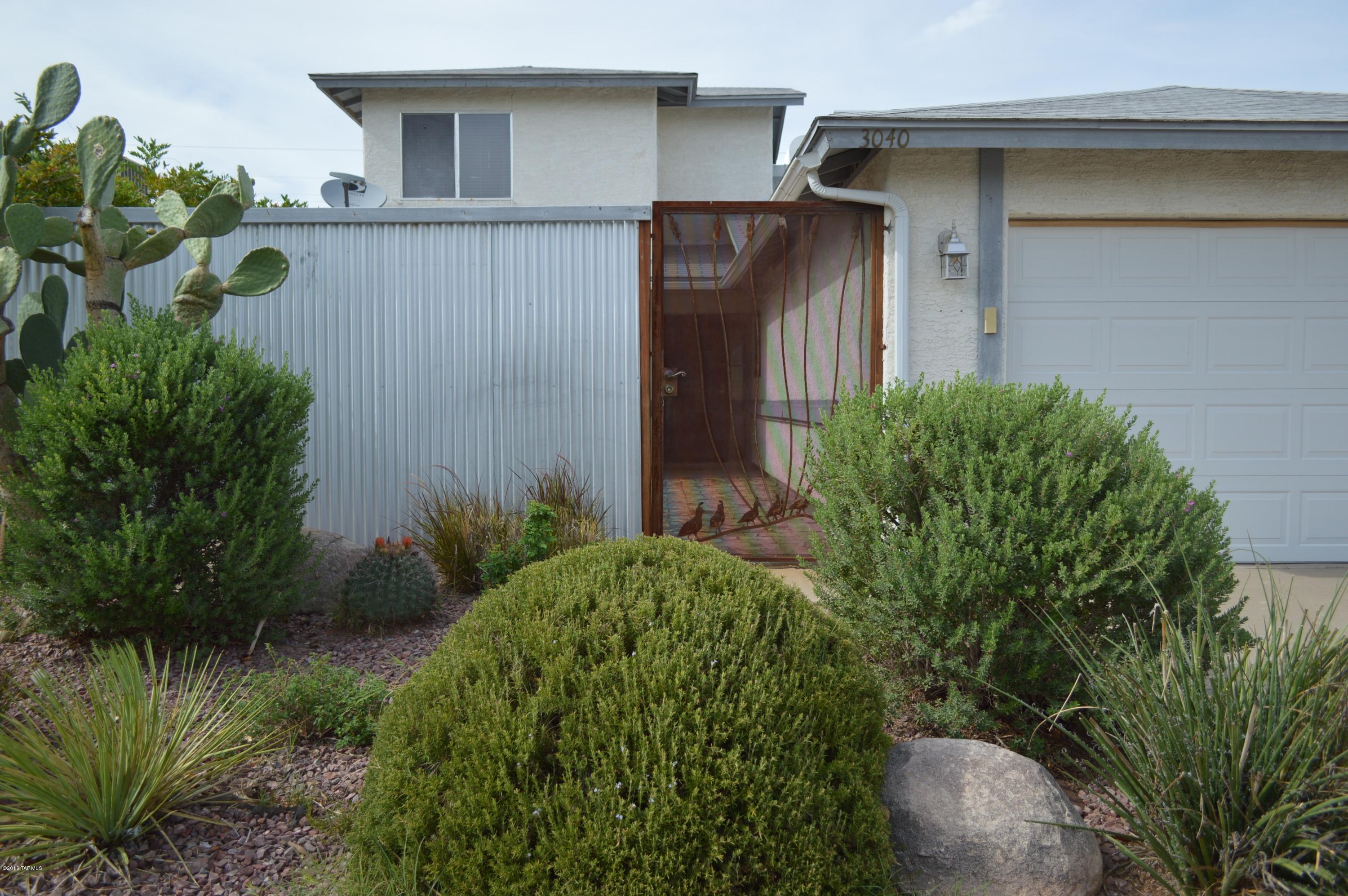 This is a must see! The inviting back-yard oasis with sparkling pool and spa is only one of this Northwest home's many highlights. There is no HOA in this established neighborhood! With common areas next to and behind the home, there is plenty of open space to enjoy around the property. An enclosed, private front patio is a great way to enjoy the space to its fullest. 

With two bedrooms and a full bathroom downstairs, the master bedroom is its own private upstairs retreat. New, matching stainless appliances grace the kitchen, and the family room has a cozy fireplace with a view of the mountains. There is room for trailer, camper or boat storage on the side of the garage. So much to love about this place!