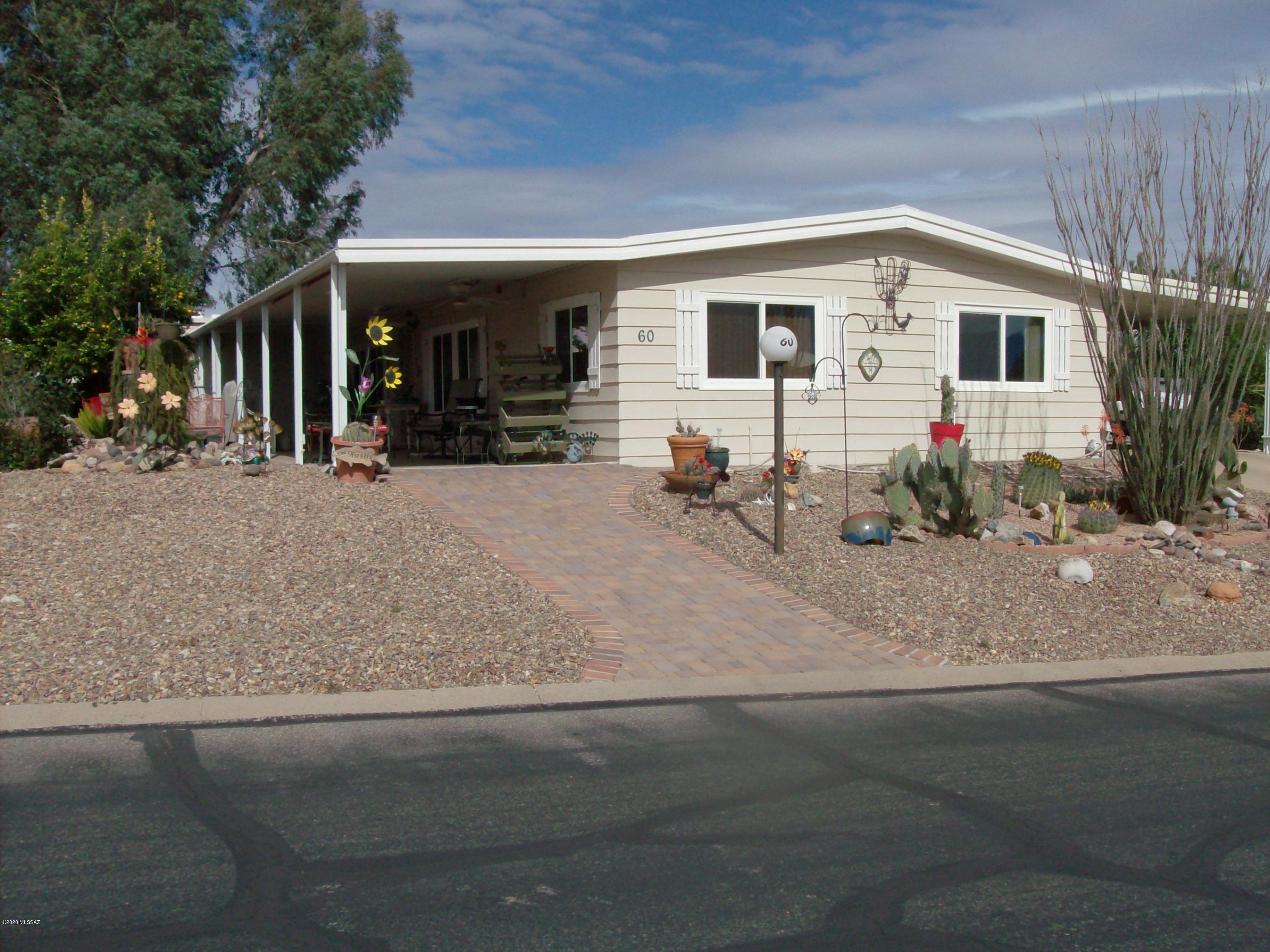 A very nice 3BR/2Bath in beautiful Pueblo Estates. Many newer features, including PEX plumbing, kitchen cabinets, countertops, sink, appliances, laminate flooring, double pane windows, A/C, 2 large storage areas with doors to fit a golf cart, patio fans, tiedowns, FHA/VA certified, more!