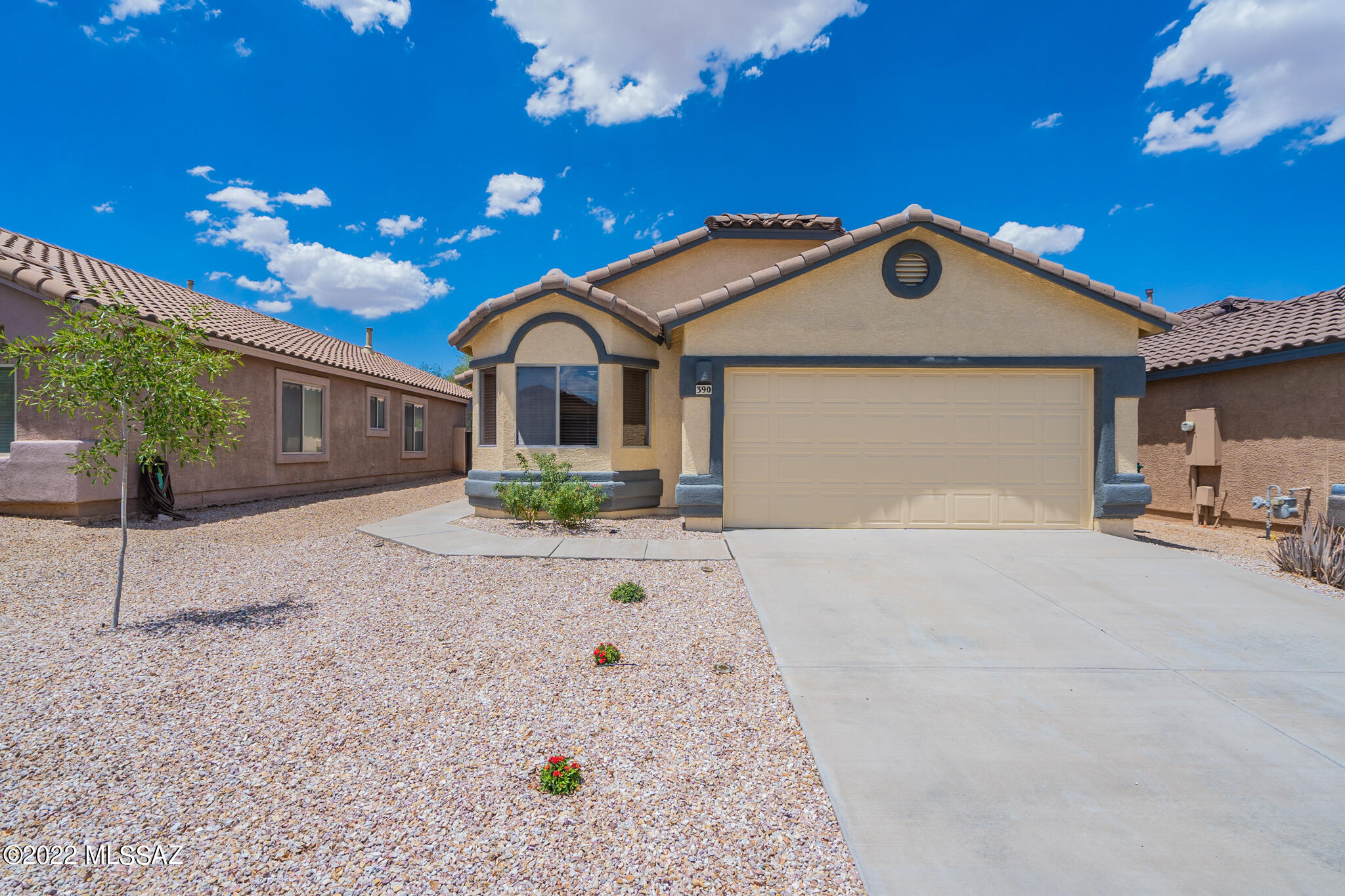 SOLAR IS PAID IN FULL! This 2007 home has an open floor plan, three bedrooms, two bath, and a den/office with French doors. Master bedroom has a bay window, walk-in closet, master bath has a dual vanity and large walk-in shower. The interior is freshly painted and the kitchen has granite counters with new backsplashes, engineered wood flooring and tile throughout the house, no carpet. Backyard has a covered patio, upgraded irrigation, with no neighbors behind you, block wall for added privacy. Great neighborhood amenities, three pools, recreational center, tennis, waking & biking paths, dog park, lake for fishing, water park and so much more. This is a must see! At this price this house won't last!