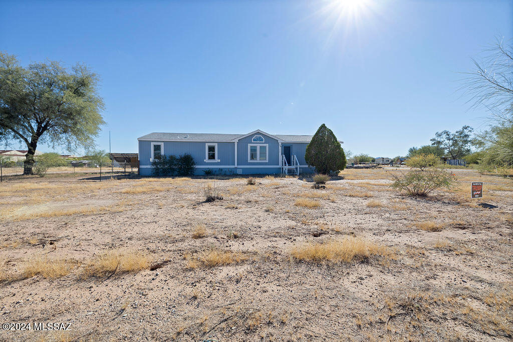 Property is range priced $265,000-$285,000. Welcome to 16725 W Calle Carmela, Marana, AZ 85653. This spacious home sits on a peaceful cul-de-sac and boasts over 1 acre of land, providing plenty of room for outdoor activities and privacy. Inside, you'll find both a separate living room and a family room, offering versatile spaces perfect for relaxing or entertaining. Brand new Anderson windows throughout. Paid off solar! Conveniently located next to a school, this property is ideal for those seeking tranquility. Enjoy the best of comfort, privacy, and convenience in this charming Avra Valley home.