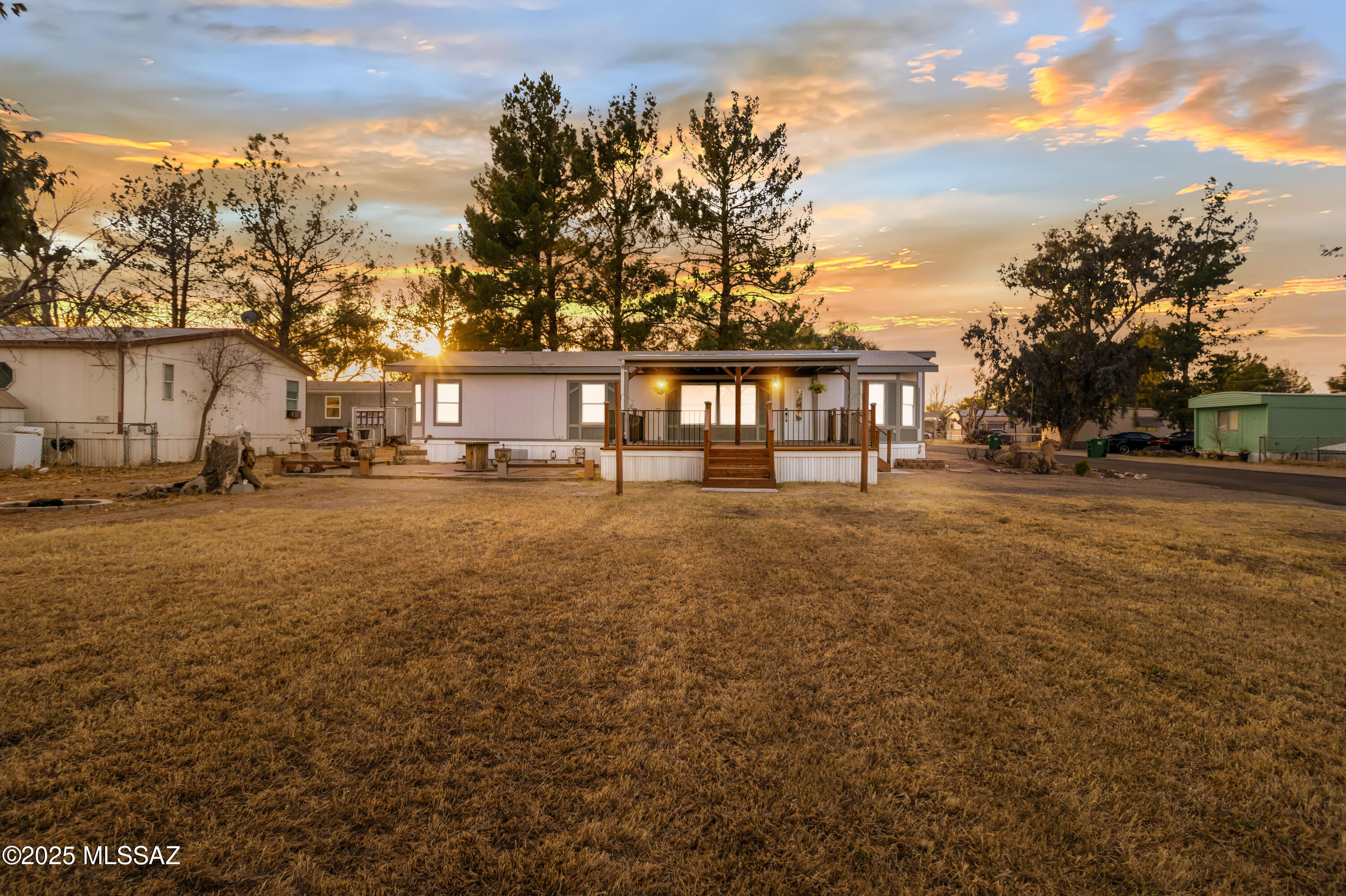 **MH HOME IS BEING SOLD WITH THE LAND BEING LEASED**
MOUNTAIN VIEWS, PINE TREES, & LAND! This completely modernly updated home is like NEW, it has been immaculately kept, has tons of recent upgrades, & is well taken care of. It has a plenty of parking that is accessed directly from the main road, a recently built and extended deck, tree plantings, & situated in nearly .3 ACRES. Inside you have a spacious, bright, & charming home. Some highlights include dual-pane windows, vaulted ceilings, fresh paint, premium flooring, & skylights. With a large U shaped kitchen that has newer SS appliances, eat-in extended island, plenty of premium gray cabinetry, wood like counters, & stone backsplash for the chef at home. The ample living room has space galore for your sectional & entertainment system . You'll also find a formal dinning space for those family meals! The extended primary has plenty of room, plush carpet, & a true walk-in closet. It Segways into an ensuite bathroom with dual sinks, modern fixtures, walk-in shower, and a soaking tub to relax in.. All of this is situated in a beautiful and tranquil lot. The exterior has a large patio to entertain guests and enjoy your sunsets. Also, a fire pit, flagstone walkway, & large storage. A local park is minutes away, as well as entertainment, schools, shopping, & the freeway. Don't miss out on this Sahuraita desert Oasis and make it yours TODAY!
