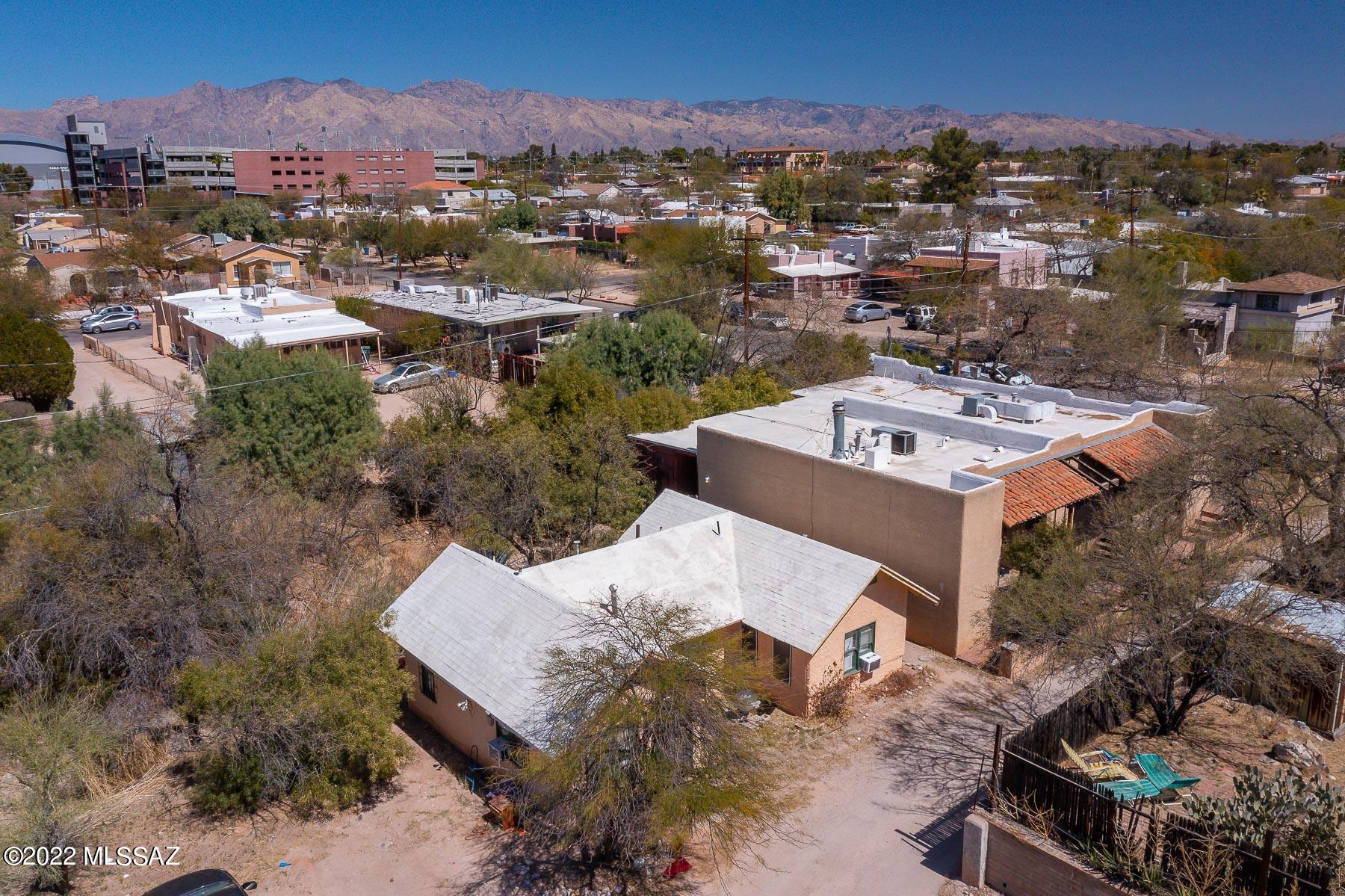 NO SHOWINGS UNTIL ACCEPTED CONTRACT!! DO NOT DISTURB TENANTS. Excellent multi-family income property for sale!  5 total rental units on this property.  There is 2 buildings.  1.) 1980 3-plex at 1,802 sq/ft  2.) 1940 2-plex 792 sq/ft.  There is 2 studios, 1 (1 bedroom & 1 bath) & 2 (2 bedroom & 1 bath) units.  Large lot at .33 acres gives lots of additional potential for a buyer.   Off street parking too!  Just south of UofA! Rents currently below market value with room to improve!  Actual CAP rate is 5%.  Estimated Proforma CAP Rate is 6.9% when adjusting rents to estimated current market value.