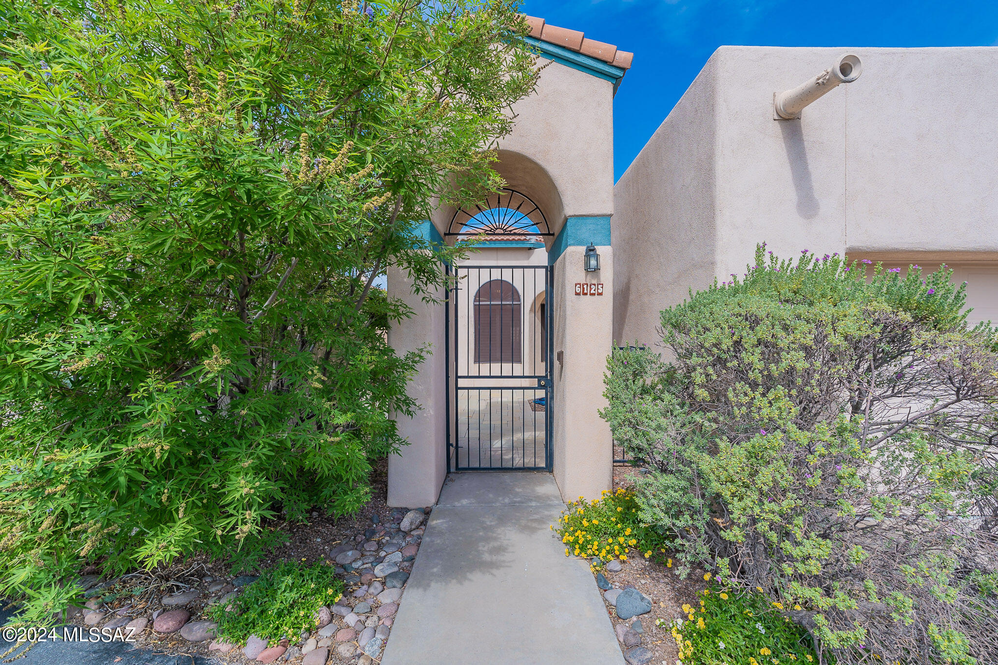 This charming split-floorplan townhome offers comfort and style in the highly sought-after neighborhood of Kachina Hills. Enter through a gated courtyard featuring elegant stone pavers. Enjoy a spacious kitchen equipped with stainless steel appliances, abundant cabinetry, and a convenient desk area. The expansive great room includes a cozy gas fireplace and a designated dining area. High ceilings and shutters throughout enhance the open, airy feel. The large main bedroom boasts a walk-out patio, dual sinks, a tiled walk-in shower, and a main closet with custom shelves and cabinetry.  A sizable private guest bedroom is complemented by a nearby full bath. An additional bedroom can serve as a versatile den with double door entry. Skylights throughout the home create a bright and welcoming atmosphere.
Additional Amenities: The garage features epoxy flooring and built-in cabinets for added storage. Recent Upgrades: New Roof (2024) Heat Pump (2021) Hot Water Recirculation Pump (2019). 
Gated Community with  Pool and Spa. Close to Shopping and Golf. A fantastic spot with breathtaking views and all the conveniences you need.
Don't miss out on this well-maintained gem with a blend of modern upgrades and classic charm. Schedule your viewing today!