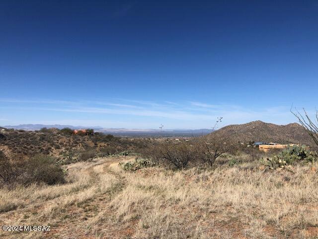 LAST ONE AVAILABLE. ''End of the Road'', 5 Acre parcel has DROP DEAD FABULOUS VIEWS  over the TUCSON VALLEY with close in Mountain Views as well. Build on a gentle pad or move up the hill for bigger views. If you're looking for a Peaceful and Quiet, Rural Lifestyle walk this beauty. RH zoning allows for horses and animals. NO CC&R'S or HOA. Build what you want and when. Seller drilled well and installed pumps, tanks, etc (see documents for details). Underground electric and water lines have been brought to the parcel. Download aerial map for easy directions. Show anytime.