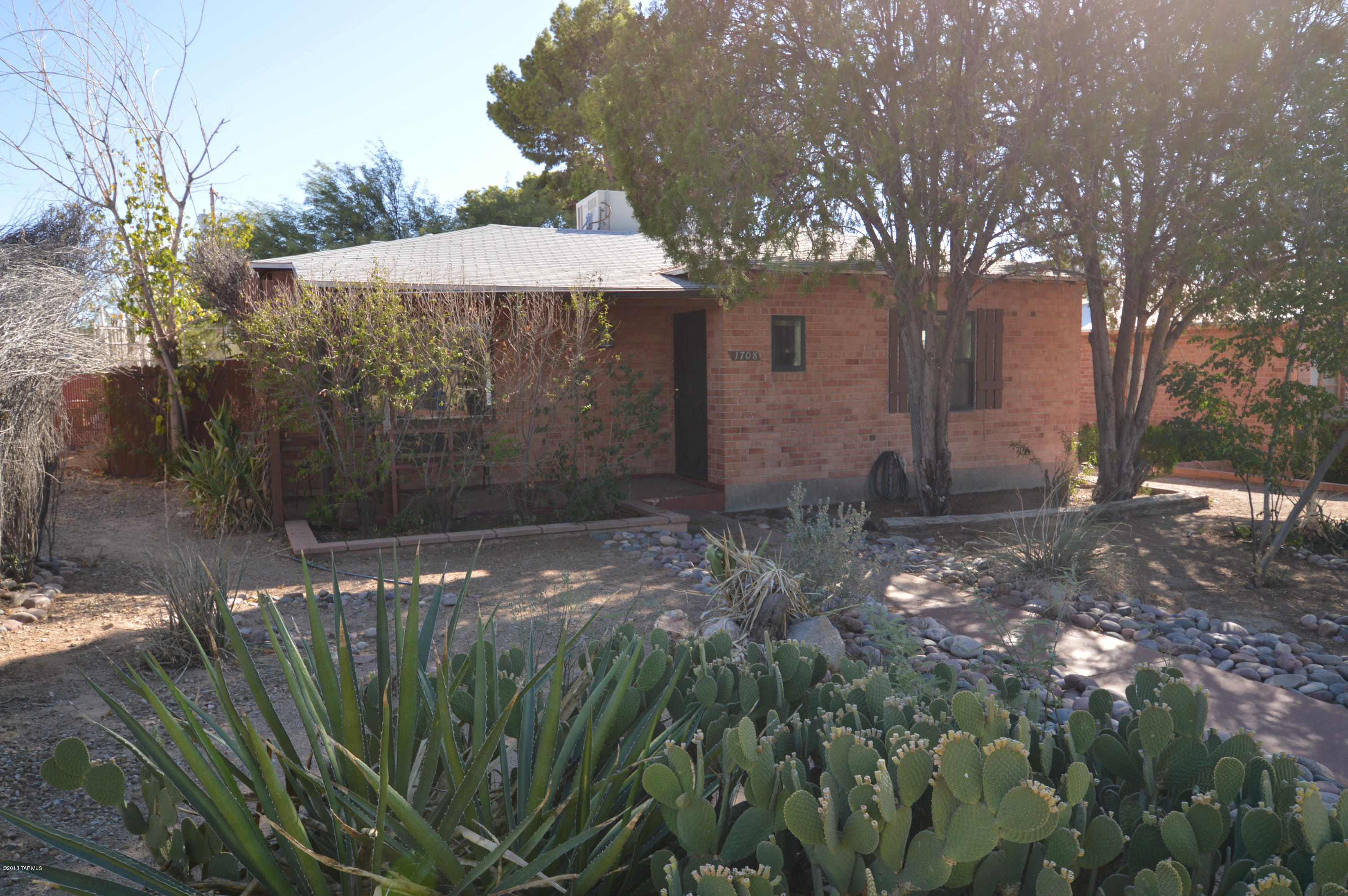 Gorgeous home just minutes from UMC, Shopping, transportation, and the U of A! This charming home come equipped with AC for cool comfort! Upgraded windows add to the charm and economy. Open floor plan with lots of character. HUGE back yard for entertaining. Large arizona room for extra space. Immaculately cared for and ready for you. CALL TODAY before this one get away!