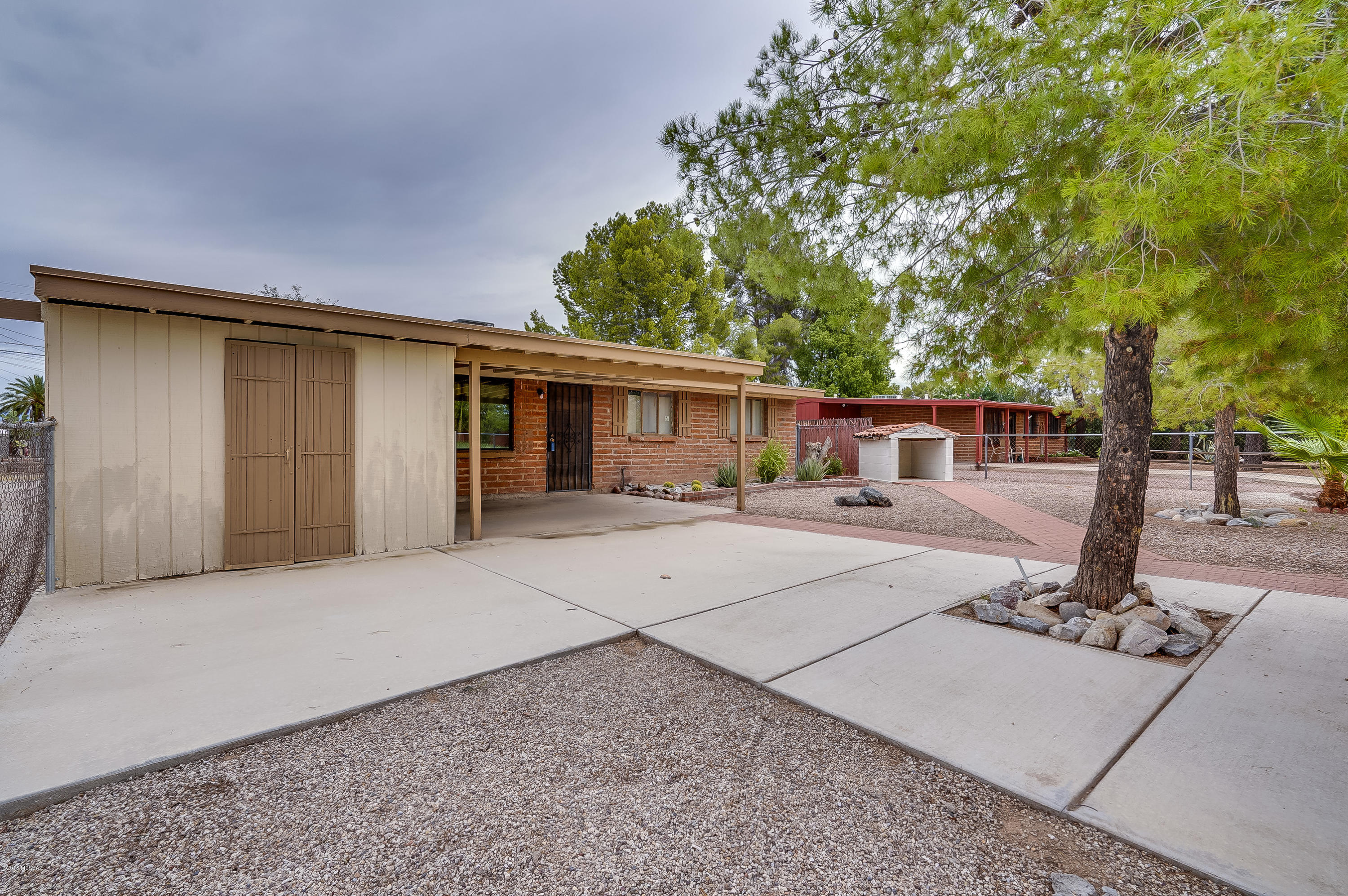 Come see this charming 3 bed, 3 bath, 1,340 sq ft residence right in the central part of Tucson! Tile flooring throughout, new AC with a Nest thermostat, addition that features a bar area perfect for entertaining, a fenced front yard with low maintenance landscaping, and a huge backyard with mountain views and a storage shed for all of your toys! You'll love this fantastic location, close to the Reid Park Zoo, golfing, The University of Arizona, downtown, shopping, restaurants, & more. Must See!