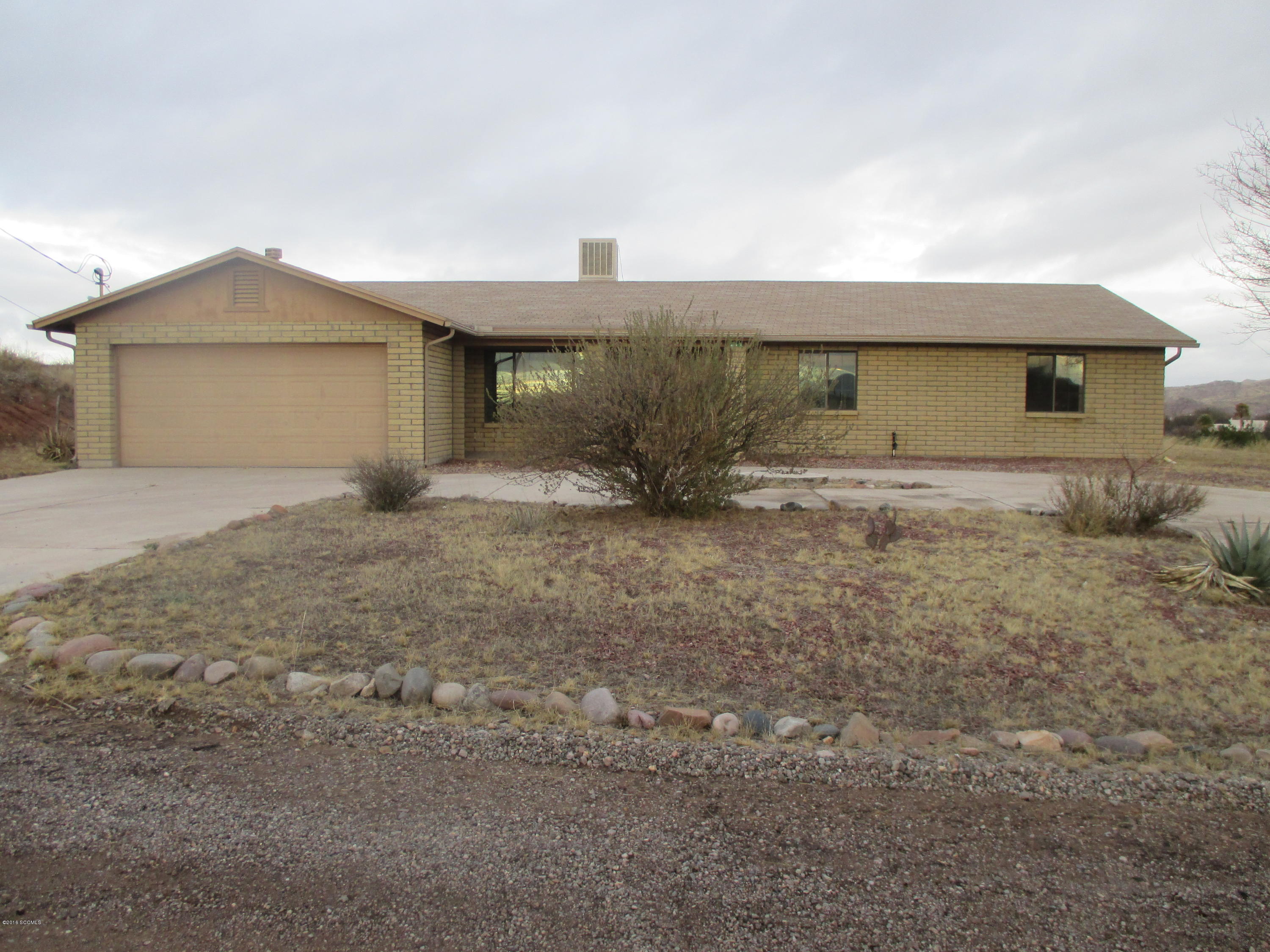Great floor plan with great views. Lots of potential. Large flat lot with circular concrete driveway. Family room with fireplace and separate living room make this home very roomy.