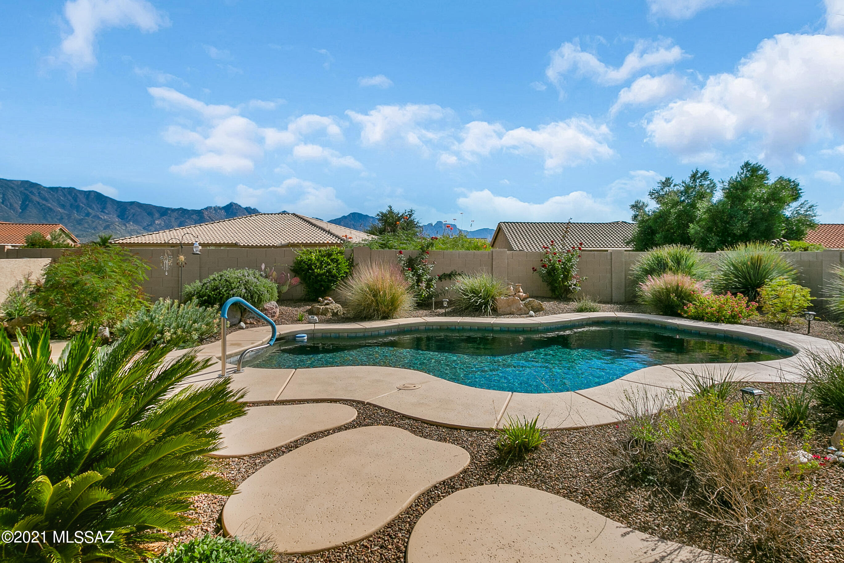 Beatiful Newport Model with exceptional views of the Catalina Mountains! This is a must see to appreciate the updates and care given to this home. Includes: natural wood flooring, cherry cabinetry, plantation shutters, quartz countertops, walk-in pantry, SS appliances including gas range. This gorgeous backyard boasts a Pebble Tec Pool, a built-in BBQ, lush lanscaping, updated irrigation system, and oh the views! Ready for you to entertain guests.