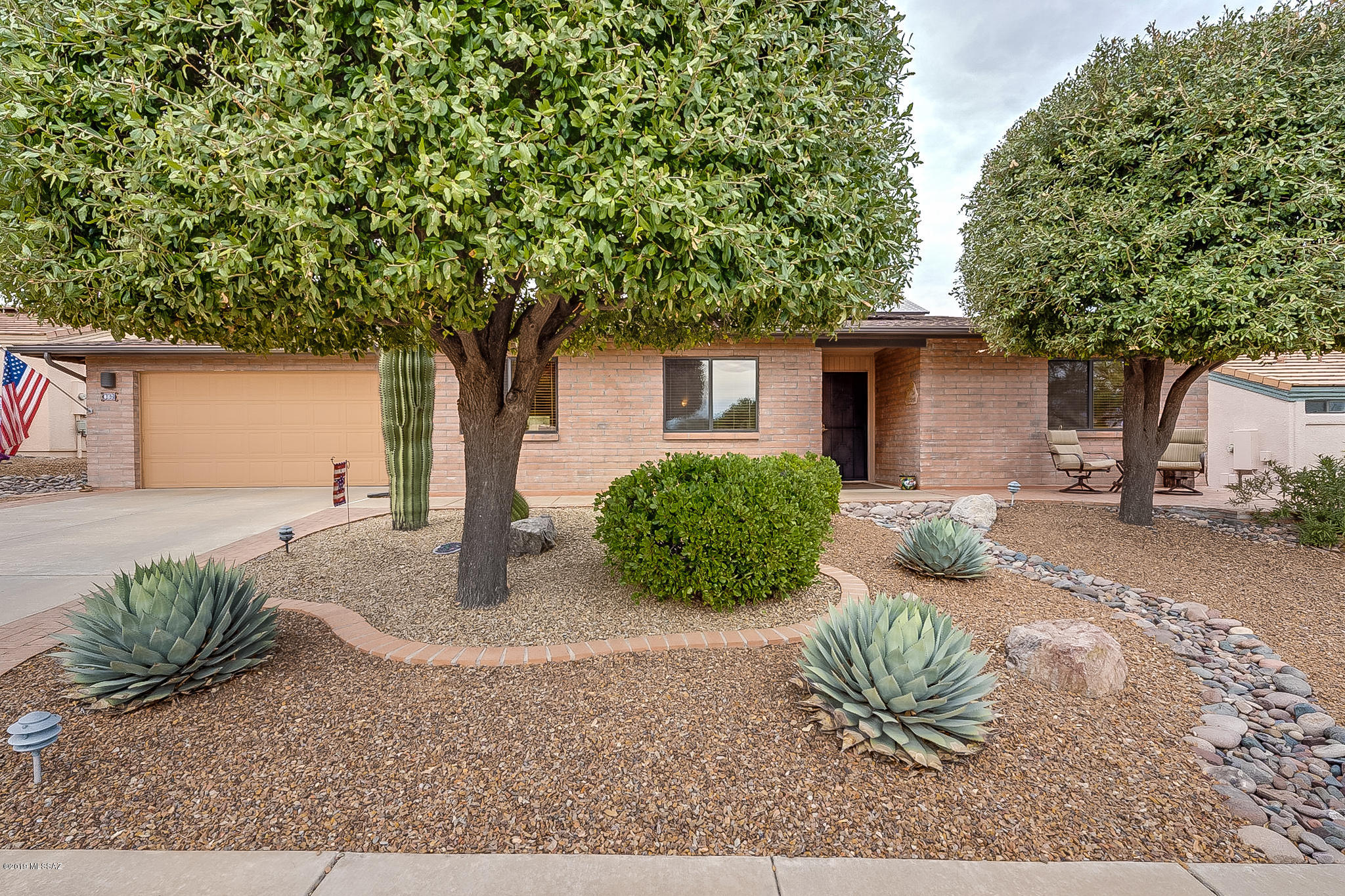 JUST MOVE IN AND ENJOY! No worries with all the seller has done: Roof replaced, newer HVAC, tile floors, OWNED solar panels, and lovely extended back patio. The kitchen has granite counter tops, white appliances, convection oven, cooktop stove, and pull outs. The laundry room has space for a desk. Other features include water softener, reverse osmosis, sunscreens, garage cabinets, and workbench. Very serene back patio with flagstone and orange tree.