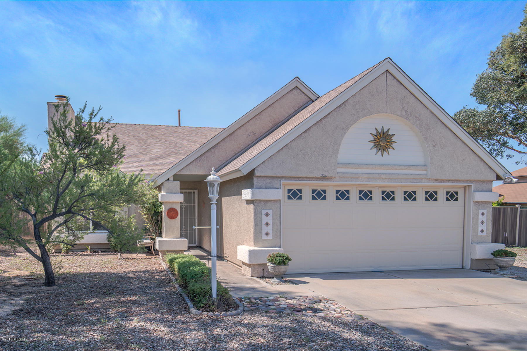 A house that truly has it all in the highly desirable Northwest side of Tucson. This house sits a quarter acre lot and has a pool! The yard isn't only large but it is private. There are no homes behind you here. The kitchen has been updated with beautiful custom wood cabinetry and granite counters tops. There is even a granite breakfast bar. There is plenty of space for everyone with 4 large bedrooms.  The kitchen window looks out to the screened porch which leads you to the sparkling pool, gazebo and storage shed. This yard is perfect for entertaining. The home is in a great location. Right across the street there is grassy community park that is perfect for the family to spend a leisure afternoon. Don't miss this gem of house. Come see it today.
