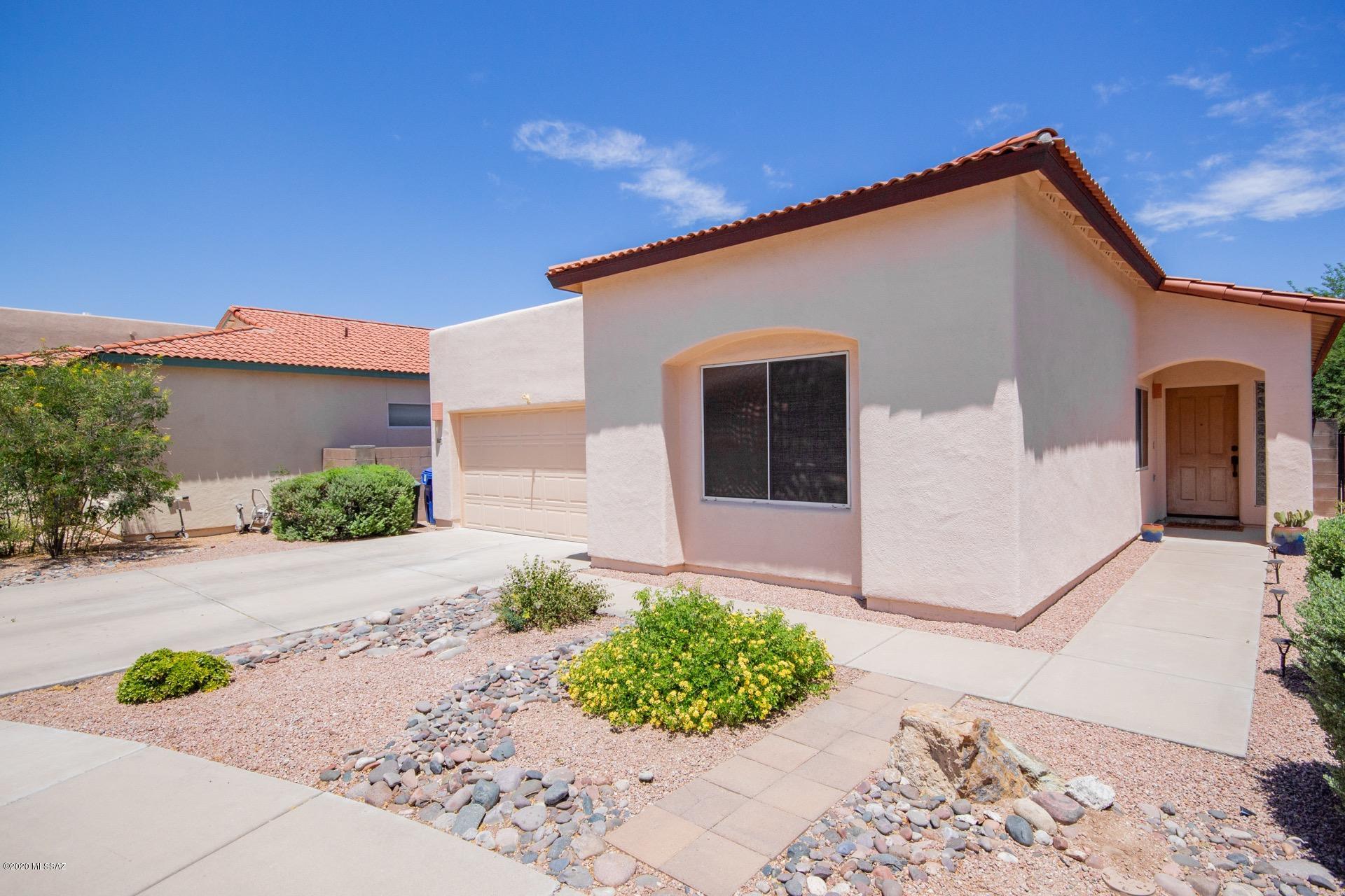Absolutely Gorgeous ''Model'' perfect home in the desirable Community of Pantano Ranch.  Soaring ceilings, warm & welcoming palette, window shades, ceiling fans, beautiful tiled floors, plant shelf, & French doors to patio from dining area.  Breakfast bar, quartz counters, under-mount sink, SS appliances, pantry, subway tiled backsplash, & handsome wood cabinets w/stylish hardware.  Plush carpet in all bedrooms, 2 pristine baths, & large closets. Interior laundry closet for your convenience.  Serene backyard setting w/a covered patio, shade trees, & patio for dining.  This wonderful home will not disappoint!