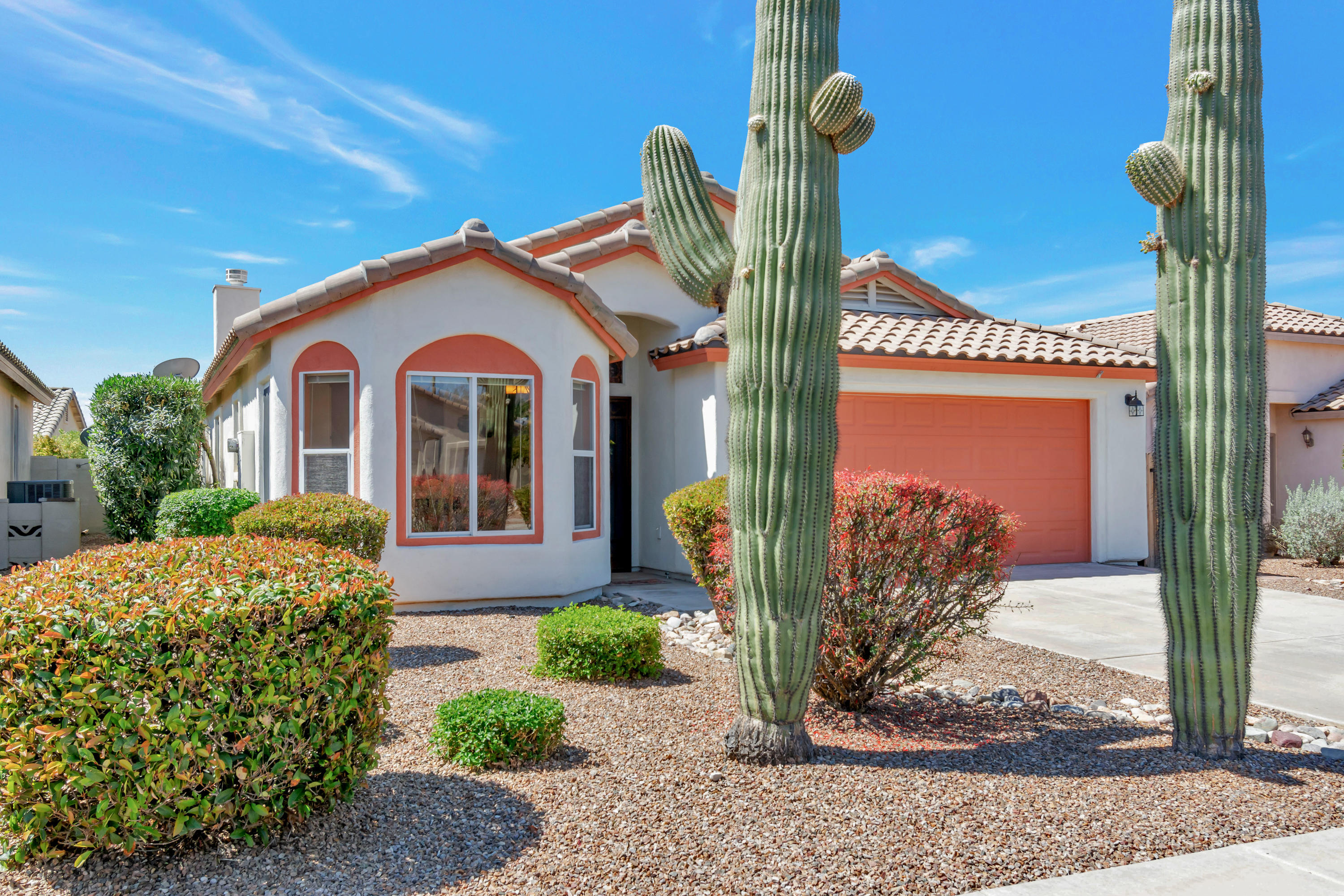 This beautiful Dove Mountain home has 2 Private Owners Suites, with an Office/Den or 3rd bedroom. The owners en-suite boasts a spacious walk-in shower & closet, dual sinks & plenty of storage. High vaulted ceilings & sliders take you out to your private backyard to relax & enjoy a covered patio, fountain, built-in BBQ, pavers, & a Gas fire pit. You will love the humming birds, Mountain Views, with fantastic sunsets, & mature shade & fruit trees. Inside there is an open floor plan with vaulted ceilings, a fireplace, great room & formal dining. The eat-in kitchen has a bay window, Corian counters, light cabinetry with ceramic tile.  Newer HVAC, refrigerator, BBQ & water heater. Neighborhood park has tennis, basketball, volleyball, walking paths, ramadas, grassy areas & a dog park. Close to I-10, restaurants, shopping, a new Dove Mountain K-8 CSTEM school & Tortolita Preserve Trailhead.
