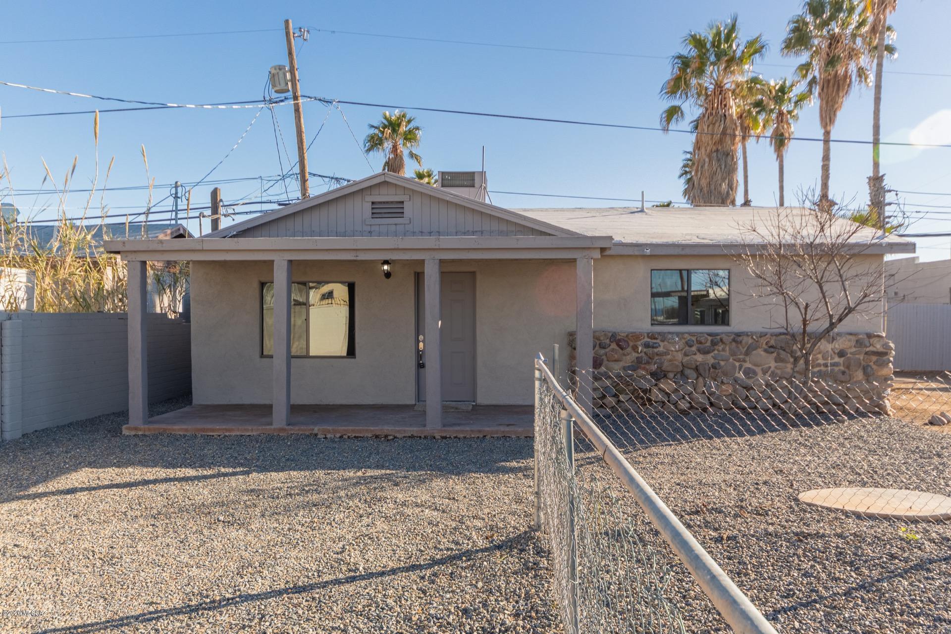 Incredibly charming 3 bed/1 bath remodeled home, with guest house (2bed/1bath) available in south Tucson. Excellent location, nestled just off of the I-19, within easy reach of shopping and restaurants and just a short walk to the elementary and middle school. Step inside to an inviting open floor-plan with tasteful upgrades throughout. Spacious living and dining area lead into the highly upgraded kitchen complete with ss appliances, a gas stove, stylish cabinetry and sleek granite counter-tops. Plush carpet and beautiful wood look flooring in all of the right places. Generously sized bedrooms. Master includes a walk-in closet and private en-suite. Huge front hard is primed and ready for your personal touch. Enjoy mountain views from the front covered patio. Call for your showing today.