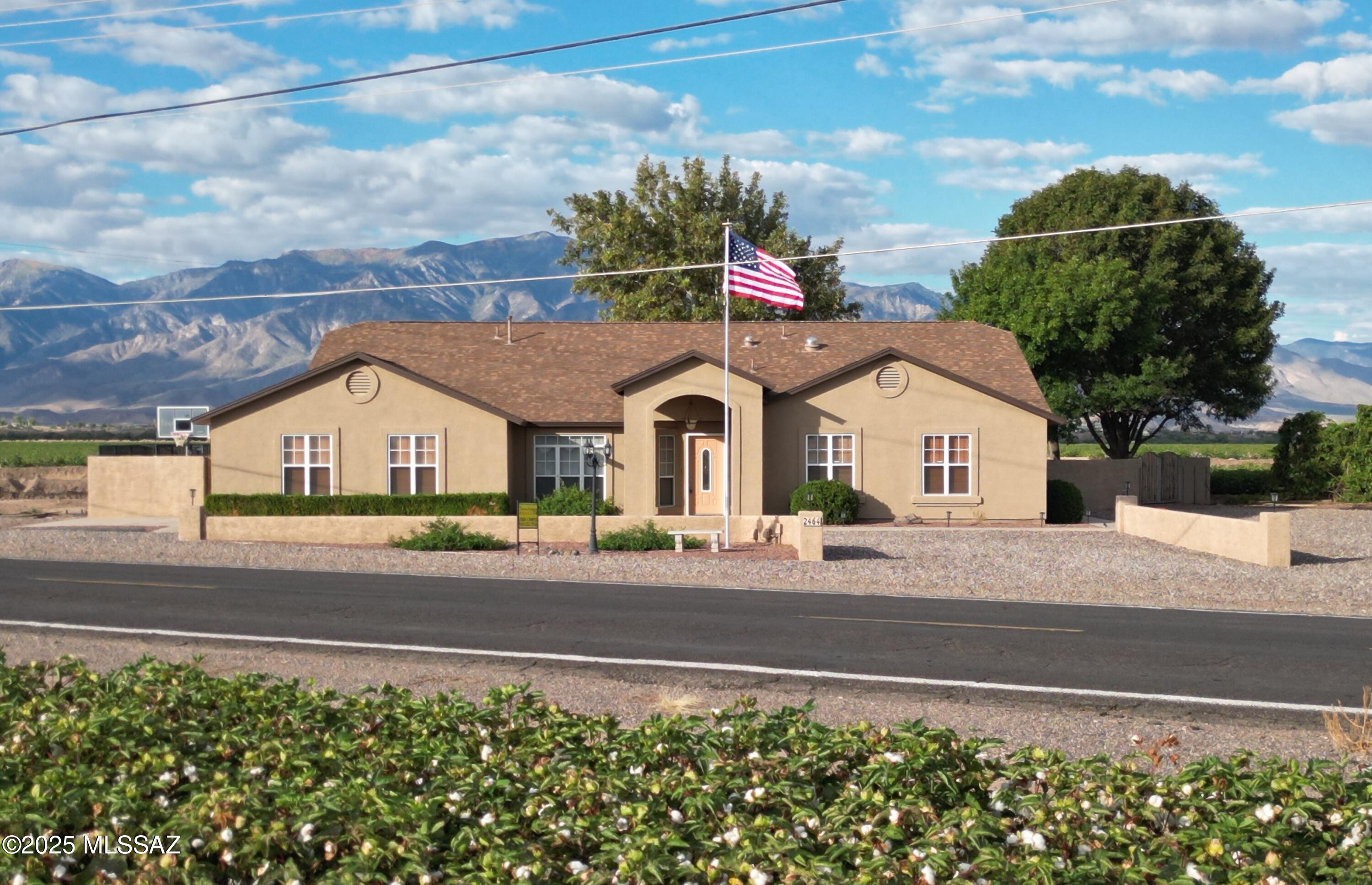 Situated on an acre east of Hwy 191, this mini-ranch has everything you need for large and small animals. The rare pasture has irrigation rights and is accessible from the horse barn. There's also a dog run and pig facilities. The house has 3 large bedrooms along with an office that could be a 4th. The backyard patio faces an uninterrupted view of Mt Graham and has plumbing for gas grills and a lovely pergola. The updated kitchen has lots of cabinets, an island, new granite countertops/sink and a butler's pantry. There is also a large pantry in the laundry room area. Relax in the front living room or in the large open kitchen and great room area. The bedrooms and family room have new carpeting and the primary bath has a new shower. Ask your agent for a full list of upgrades. The air conditioning unit was replaced a few months ago and the exterior was painted in February 2025. The roof was replaced in 2019.