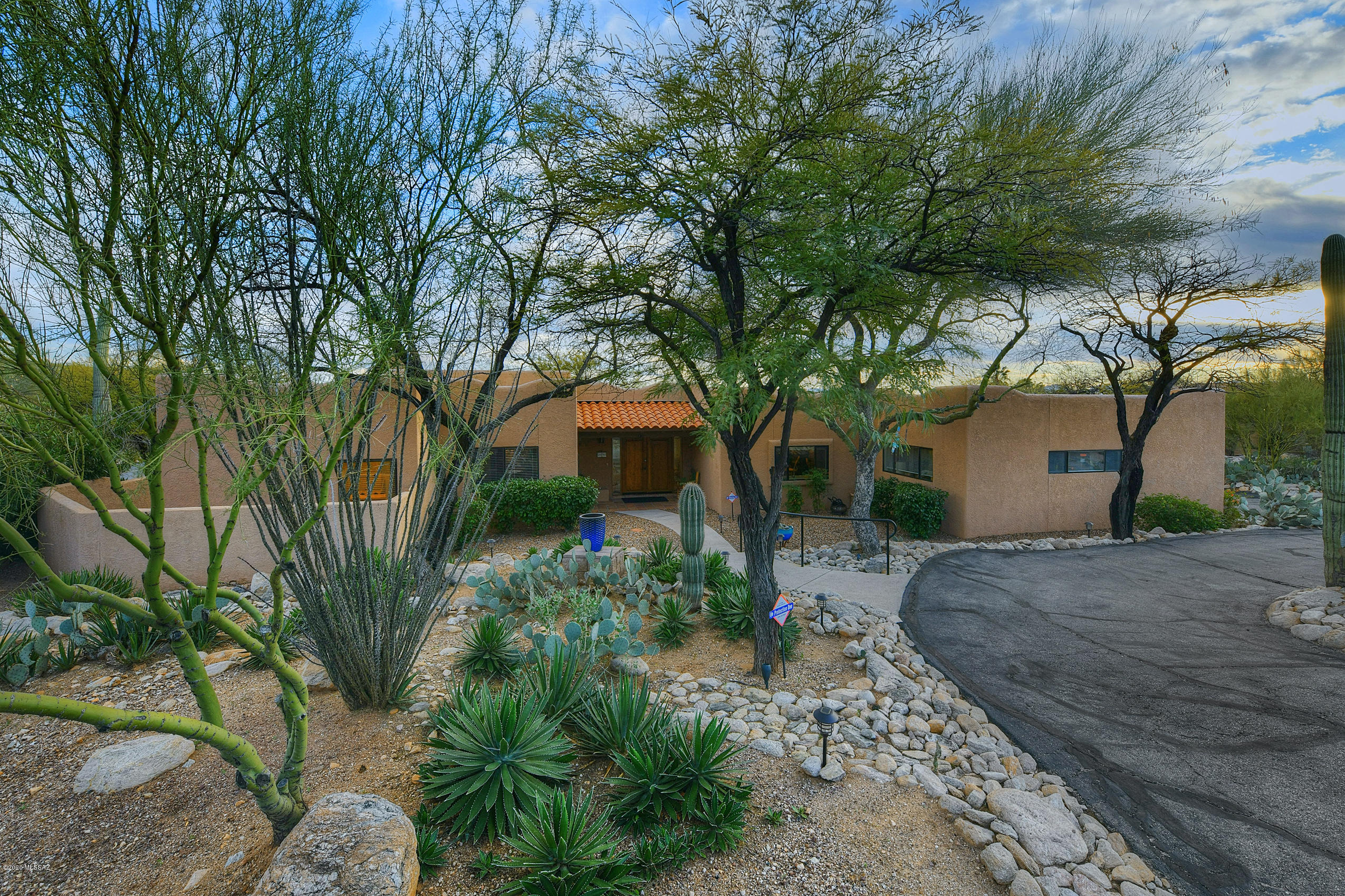 No, it's not a mirage, this REALLY is an oasis in the desert! This southwestern style home is a dream come true. Elevated above the city lights, you will be in awe of the spectacular sunset and mountain views from the pool and spa. Enjoy a meal cooked fresh on your built in grill on the covered flagstone patio! The interior of this home boasts gorgeous exposed wood details throughout with three spacious bedrooms, two generous living spaces, plus a functional office this 3049 sqft home has ample space for you and yours.