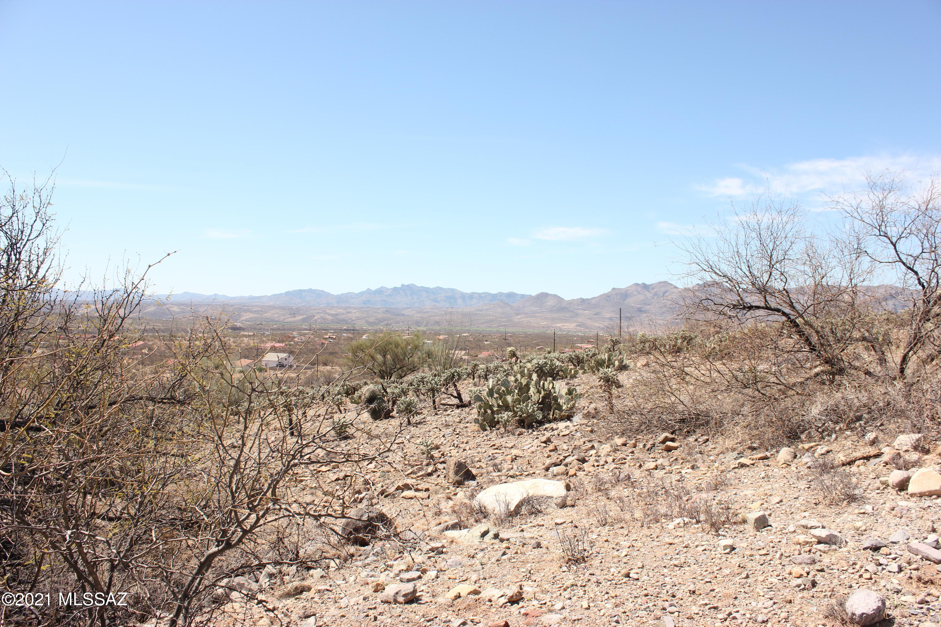 sloped residential lot, all paved roads.  Electric water and sewer available in this Subdivision of Villas 12.  Good views.