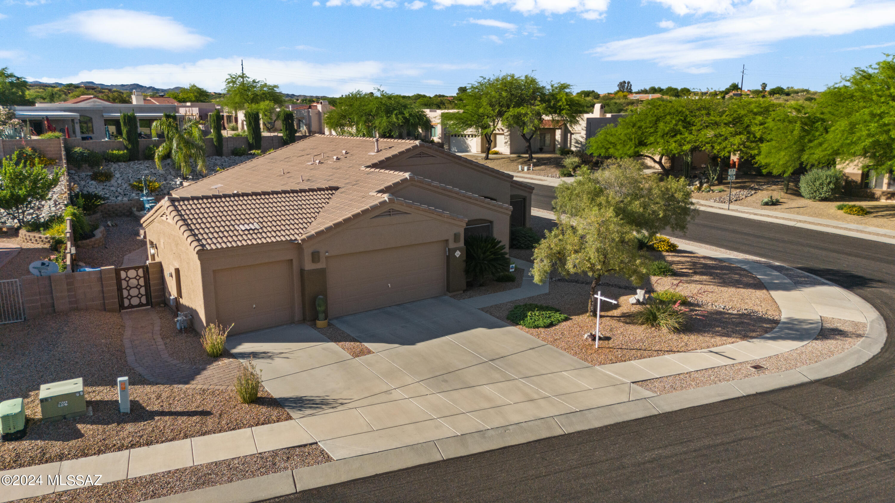 Oro Valley BEAUTY ready for you! Private pool/spa in tranquil surroundings of your yard meticulously manicured, mature vegetation with irrigation & timers. Featuring tons of storage inside & out. Custom upgrades include built-in, modern Cherrywood office credenza organizer with drawers, shelves & desk in the Office floating shelves do not convey, 3 other bedrooms & 2 full baths. Owner suite features walk in shower, 2 sinks, walk in closet. Kitchen boasts electric induction cooktop, combination microwave/convection oven, open to great room. Fully insulated 3 car garage with attic access built-in pull down. Security screens on doors. Sunscreens on windows reducing UV rays. Backyard plumbed for gas grill. House painted 2022 outside, HOA only $36/mo. Wood blinds. Fabric curtains do not convey
