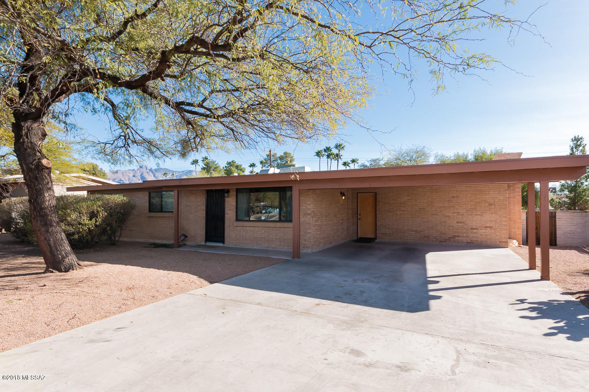 Just adorable brick home in north Tucson. Home hosts shy of 1500 sq ft, 3 beds, 2 bath, formal living, family room, kitchen w/updated cabinets & recessed lighting. Vintage flooring and countertops. Large backyard has plenty of mature landscaping, large covered porch, w/extended concrete slab and a storage shed that houses washer/dryer and water heater. Fantastic curb appeal and tucked back deep into the Northmanor subdivision. Come and bring your ideas! Don't miss out on this one!