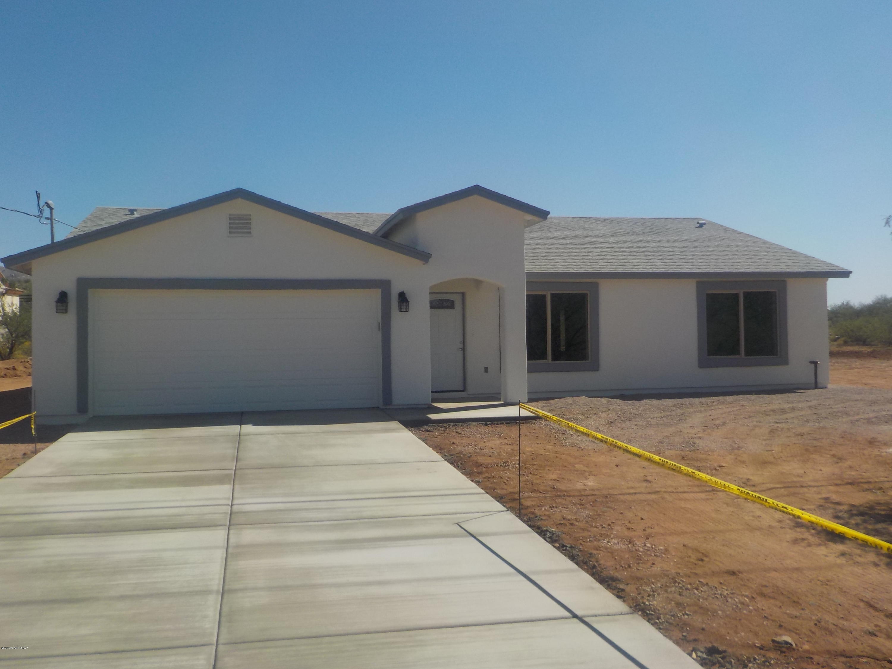 Beautiful new construction home with views. .  This home has many upgrades such as ceramic tile floors throughout, vaulted ceilings, upgraded electrical & plumbing fixtures, island in kitchen and much more. Easily accessible from the freeway.  Hurry, it wont last long! Call Christina for a showing at 520-841-1564.