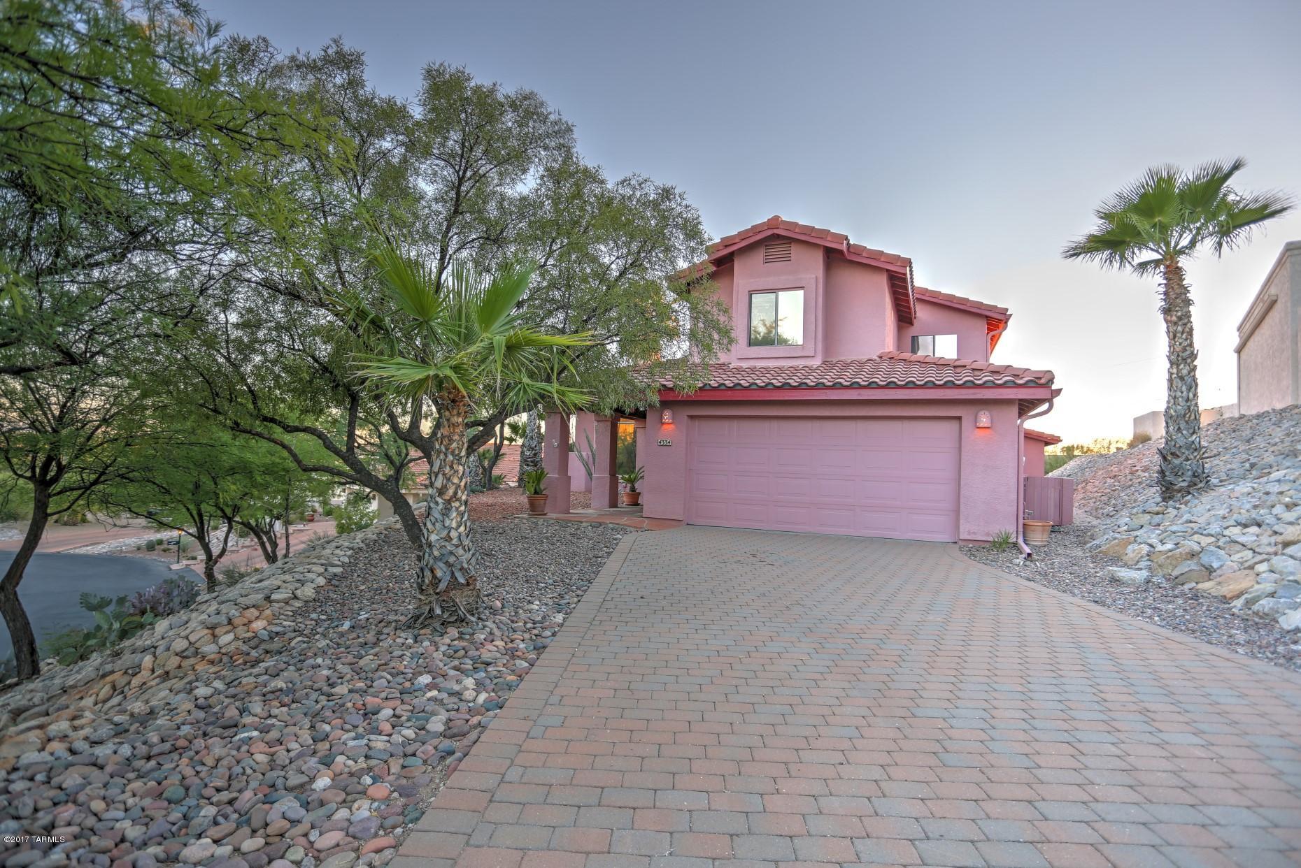 This beautiful home located in Catalina Foothills is in the lovely gated neighborhood of Rio Robles Estates. There are 4 bedroom and 3 bathrooms. There is incredible natural light from the many windows with high ceilings adding to the spacious feeling in the living room. Plenty of room for a separate home office or used as a hobby or craft area.New HVAC system installed and new carpet throughout.  Fireplace in the family room. Chef delight with lots of cabinet storage and full size freezer and refrigerator. Loft area upstairs could be used as reading area or play space. Outside there is a wonderful pool for our hot summer days and the home is situated so you can take in the expansive views of Tucson. So much to see and enjoy! Come see this gem !