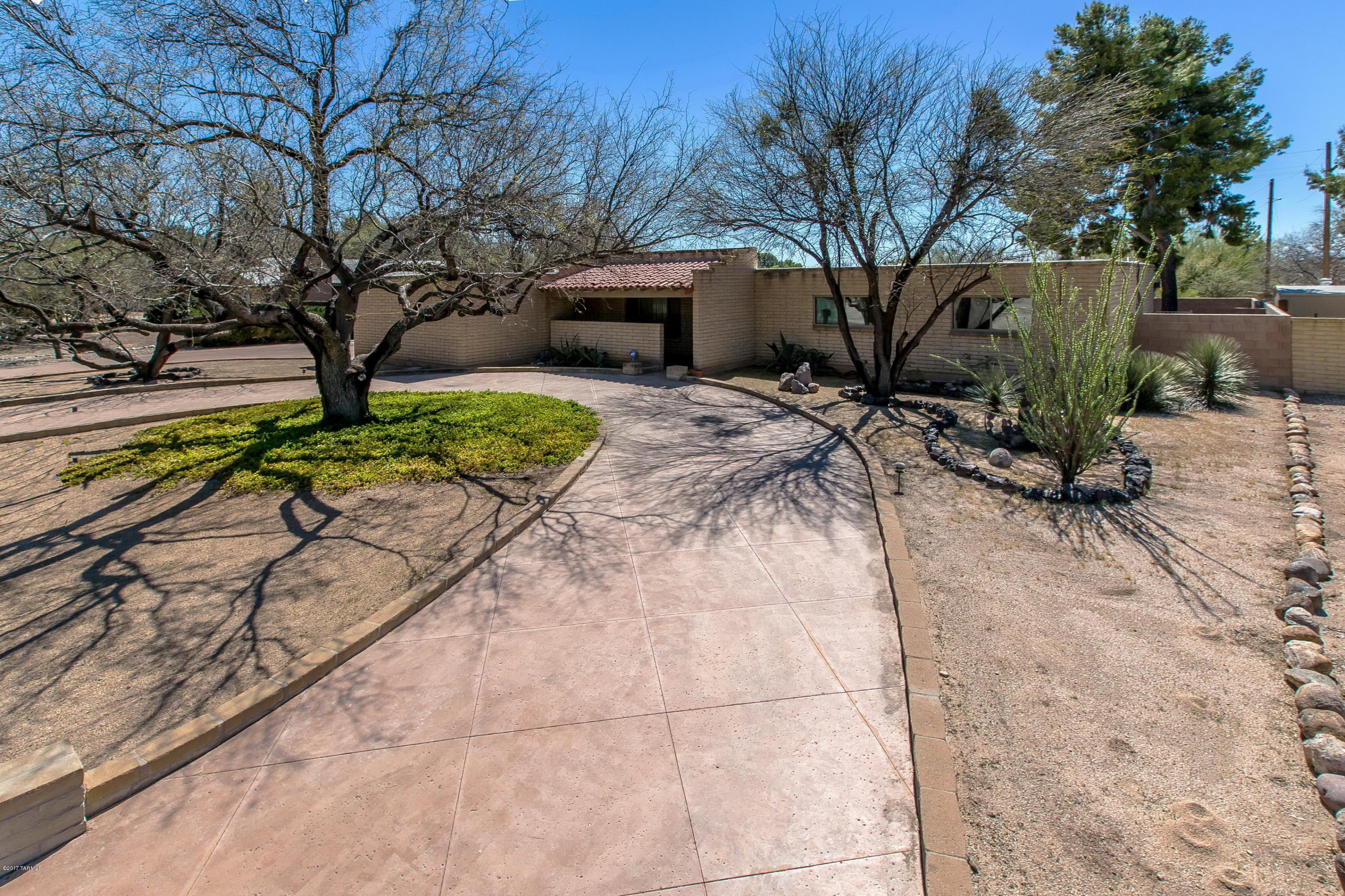 Location…location...location! Private and peaceful with mountain views, this solid masonry home in a sought after neighborhood is just waiting for your personal touch! The circular drive provides wonderful curb appeal to this 4 bedroom, 2 bath home. Pride of ownership is evident throughout…new dual pane windows and sliding glass doors help bring in the light, and the kitchen window overlooks the large yard with huge covered patio and sparkling pool! Custom wrought iron gates enhance the backyard oasis, and the custom storage shed provides additional room for all your extras. Masonry fireplace in the living room adds a cozy feel to the home, and easy care landscaping and top rated schools seal the deal. Submit all offers! Welcome home!