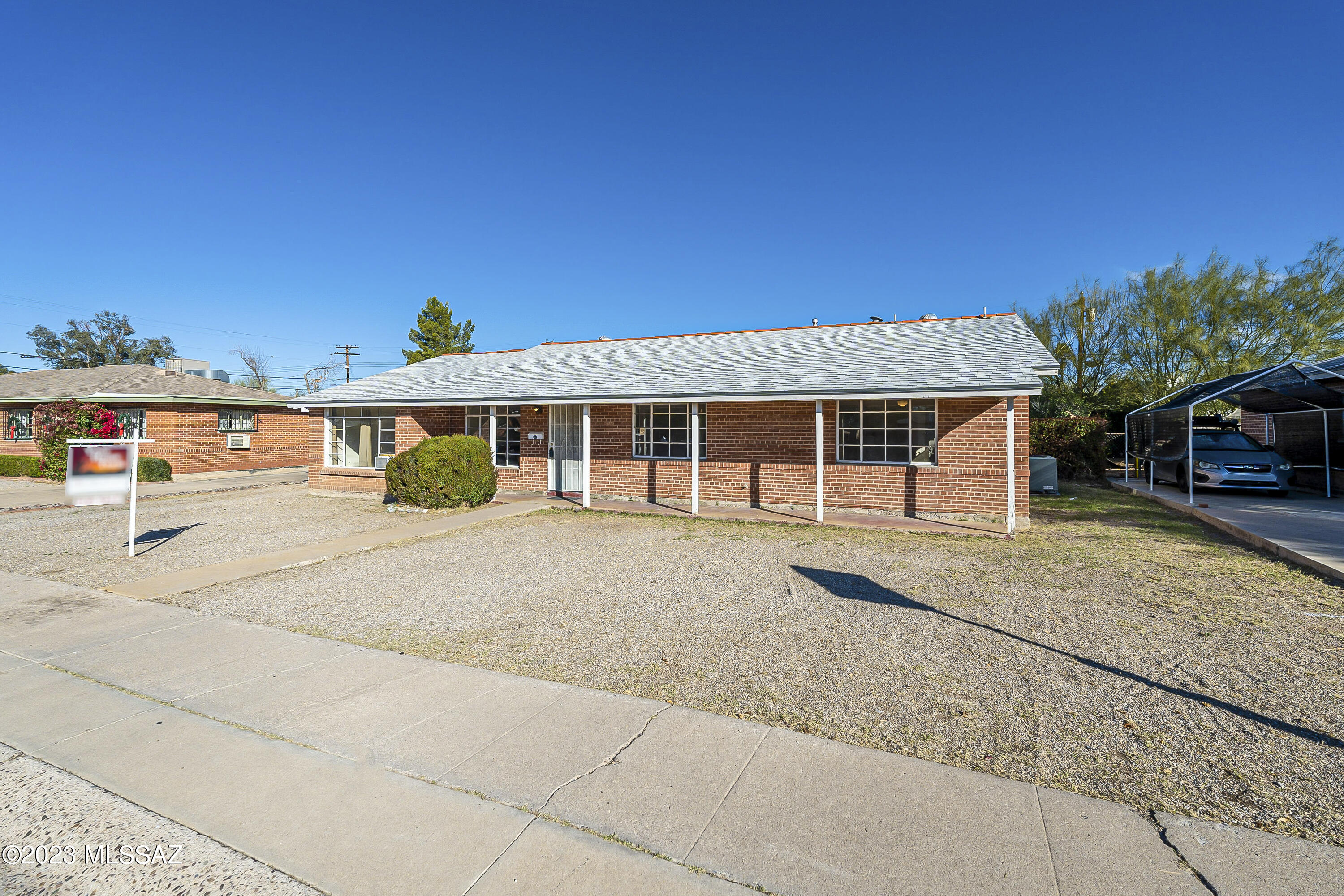 Charming mid-century brick home located in historic neighborhood of Hoffman Addition! This home boasts 4 spacious bedrooms and 2 bathrooms with 1,606 sqft. Large kitchen has peninsula that overlooks the dining room. One bedroom has private entrance and is separate from the rest of the bedrooms- perfect for extended family or home business!  The property is very spacious with .22 acre lot plus BONUS 2 room WORKSHOP in the backyard! No HOA and room for improving! This home is ready for you to make it your own with a great location that's close to schools, parks, shopping, restaurants, David Monthan AFB, and easy commute to I-10!