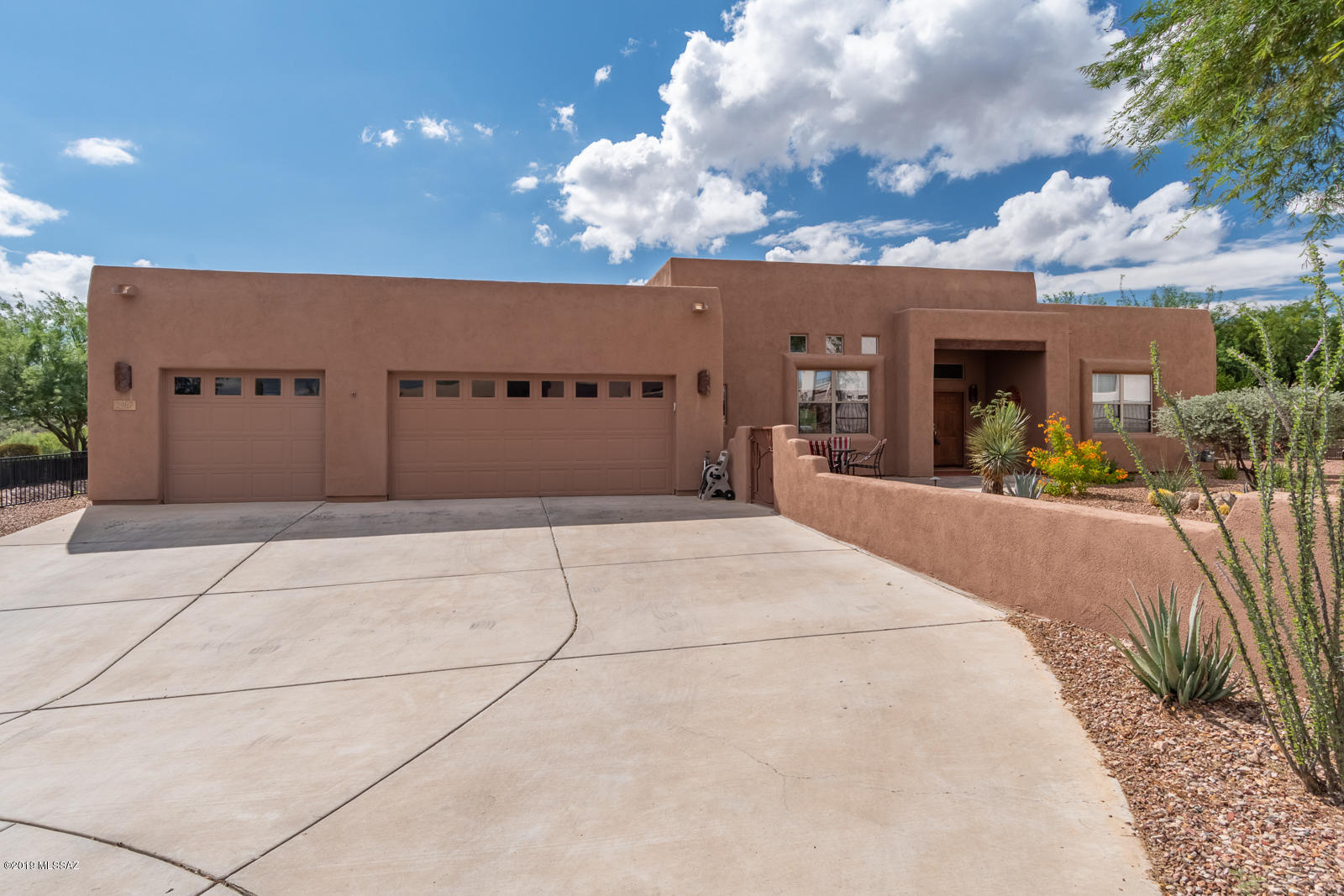 Are you looking for a home with indoor/outdoor living or entertaining? We have the home for you...check out this beautiful Santa Fe style home located in the sought after gated community on Montage Vista II. This home offers a large back yard w/large covered patio, refreshing pebble tech pool w/rock waterfall where you can float around and enjoy your views and your built in BBQ, bar w/fridge, kiva fireplace, fruit trees, artificial grass. You will also enjoy the inviting front court yard with views. Lets go inside and check out the beautiful kitchen with cherry cabinets, granite counters, SS appliances, large island for cooking or entertaining, open floor plan, dining room, tile floors, and a large laundry room w/washer and dryer included, plus a large 3 car garage for your toys or storage