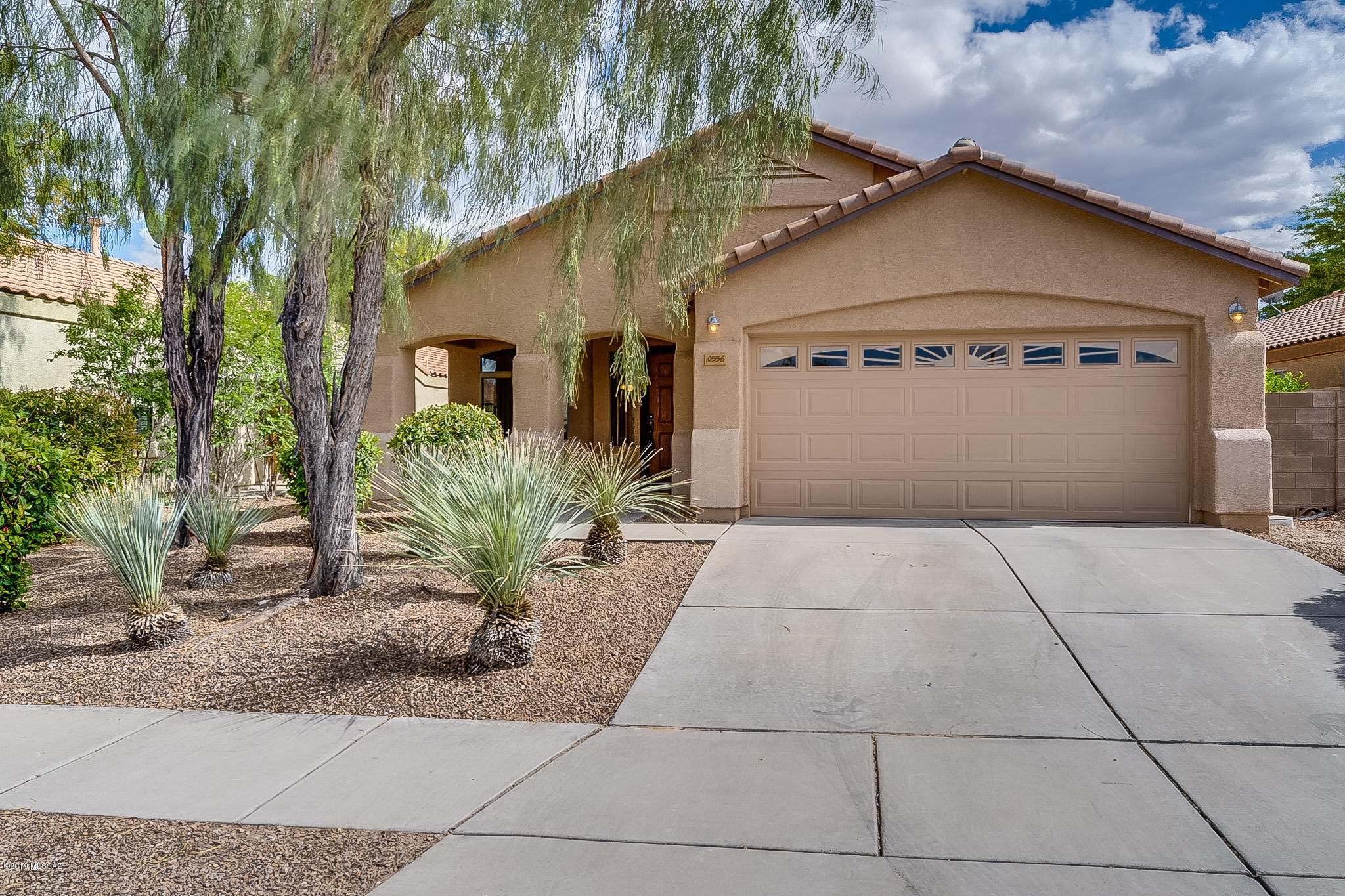 4 bedroom home tucked away in a hidden gem - Desert Willow Estates.  Tall ceilings with abundant natural light.  Large living room with dining area.  Open kitchen to the Family room. Master and one bedroom on one wing and two bedrooms with Jack and Jill bath on the other.  Family room off kitchen with access to the covered patio.  A good flow for entertaining and conversation.  Master bedroom overlooks the backyard.  Mature landscaping. Vail School District!  Nice walking trails in the subdivision and two parks.  PLEASE call LA before writing an offer for verbiage and info needed.  Thank you.