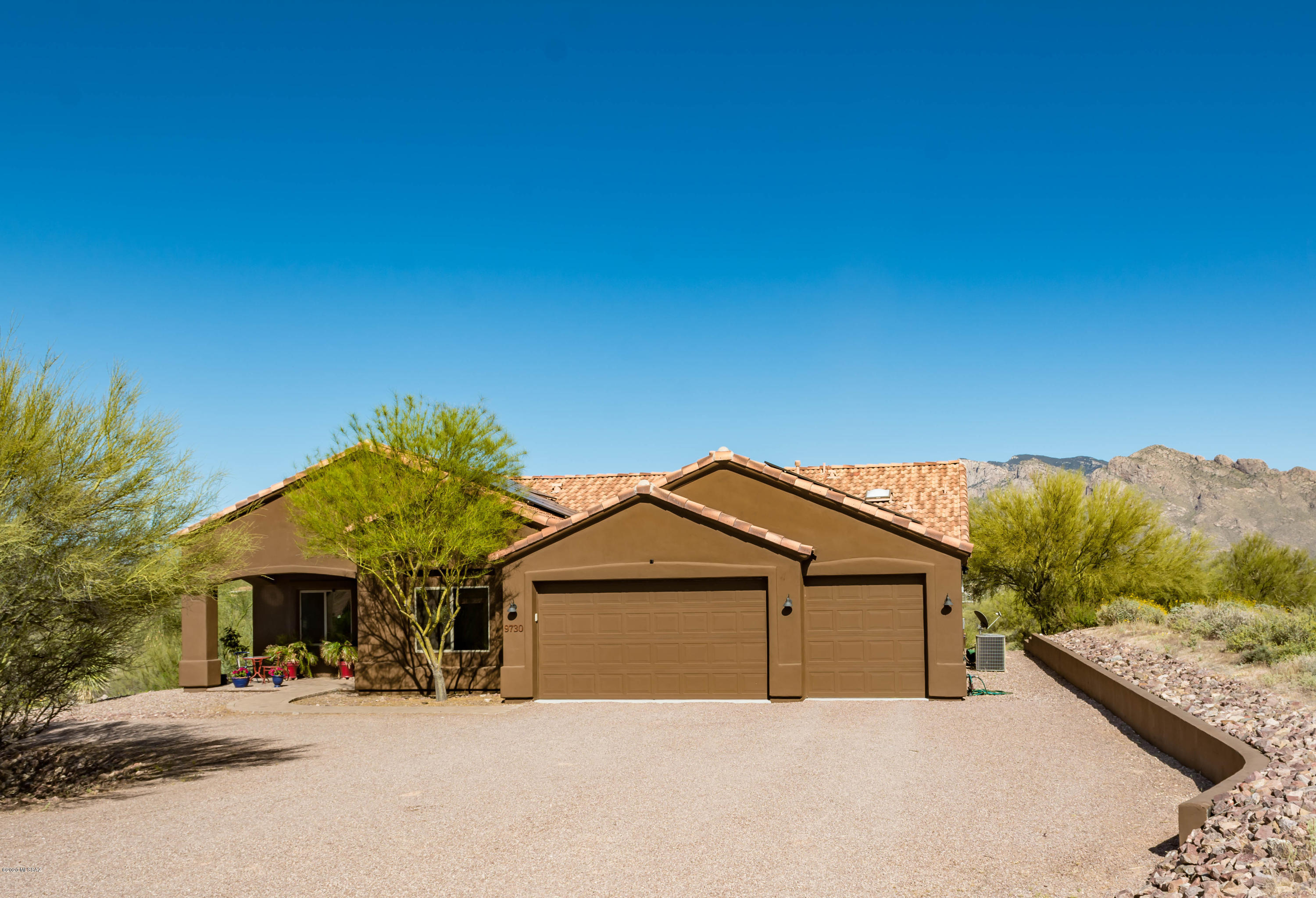 Unobstructed Catalina Mountain views from this 2005 built home on 3.3 acres - zoned for horses if you would like to bring some.  Great room concept features a spectacular gourmet kitchen w/fine custom features (see Highlights). Entertainment wall built-ins (TV conveys). Home has insulation upgrades.  Brand new solar system installed in 2019- owned outright ($31K Value). Home currently set up as a 3 bedroom + 2 bonus rooms -private den/living and office-but can easily be a 4th bedroom (closet & double doors already installed). Large master suite w/very spacious bathroom & walk-in closet. Sparkling pool to enjoy in your backyard oasis. Many tranquil lounging areas - by pool & via porch locations. Oversized garage w/extended length. Room to park RV & other 'toys' on large circular driveway.