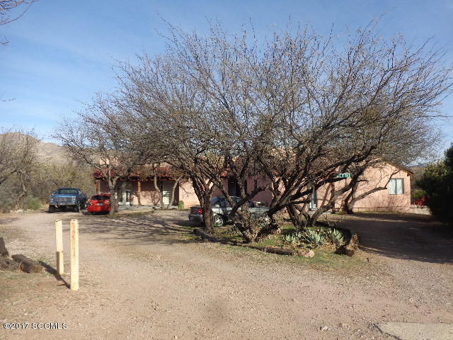 Great opportunity to own this territorial style investment property located in the central Rio Rico area. One of the units in this triplex is a 3 bedroom and the other two units are 2 bedroom. Additional features are high ceilings with exposed beams, walk in closet, air conditioned, ceiling fans, stove, refrigerator, washer and dryer.