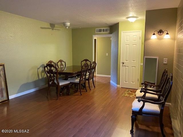 Reduced Price! Central Tucson Downstairs 2 bedroom/1 bath coop!  Move in ready unit with wood laminate floors, clean and beautiful paint job, Master bedroom wall opened to create more space! All appliances stay and kitchen  has lots of counter space for all your gadgets! Living room has lots of space for large pieces of furniture. Cash only/no rentals. Minutes from University of Arizona/Downtown, close to shopping/restaurants/bus lines, a few blocks away from Reid Park (dog park, walking path, golf course, Park/Rec center). Monthly fee covers: Property Taxes, water, sewer, trash, exterior, roof, pests, common areas, pool, parking lots and more!