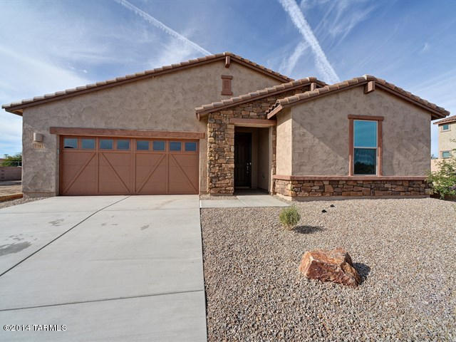 Brand new energy efficient home ready NOW for move in! Luxury features like tray ceilings welcome you in the impressive foyer and continue to the striking dining room with curved wall of windows. Gourmet central island in the kitchen with stainless steel appliances and staggered maple cabinets with under cabinet lighting in the Sierra Plan.  8' interior doors and upgraded flooring throughout the home make this single level home highly desirable.  Outdoor activities surround you at this beautiful community located at the base of the Catalina Mountains with numerous parks, hiking trails & golf courses in close proximity. Known for their energy efficient features, our homes help you live a healthier and quieter lifestyle while saving thousands of dollars on utility bills.