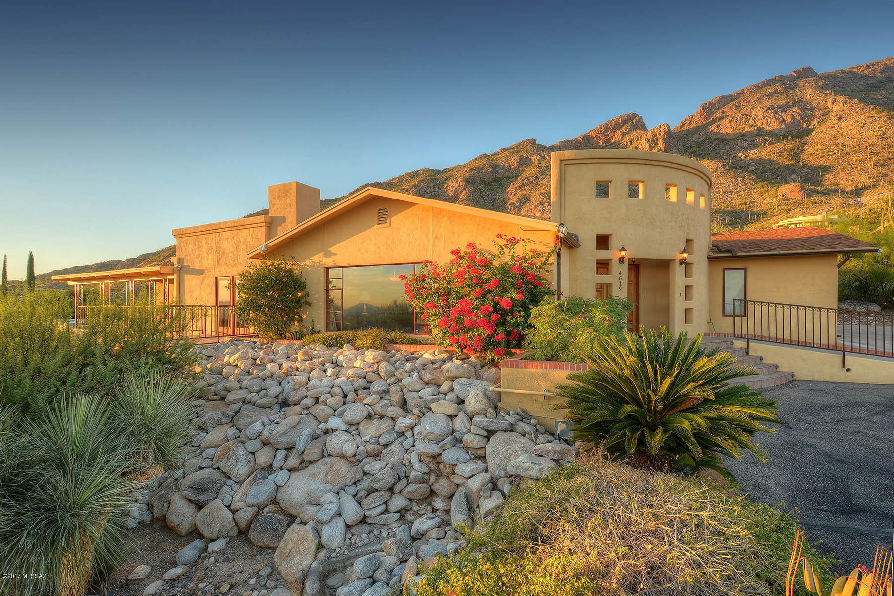 FIRST TIME ON MARKET& FULLY FURNISHED! DRAMATIC VIEWS north & south:  Breathtaking Catalina Mtns in back, & Sensational City views/lights in front! Wonderfully remodeled & expanded along the way using the best materials by licensed contractors.Seller lived in home just 2 months a year. Remodeled large-scale Island Kitchen w/African granite, S/S Appls, Elec cook top & wine fridge. Master Suite w/spacious cov'd deck & stunning city views, Master BA w/Spa room/Jacuzzi tub. 2nd BR (2nd Master) w/own bath. 3rd BR w/patio & city views.Family Room off Kitchen w/vast Mtn views & High Ceilings. Lg LR/DR has massive picture window views. Completely finished Basement w/sep entrance & full bath.Private bkyard w/brick patio, fountain & outdoor kit! Rm for pool. All furnishings included w/sale!