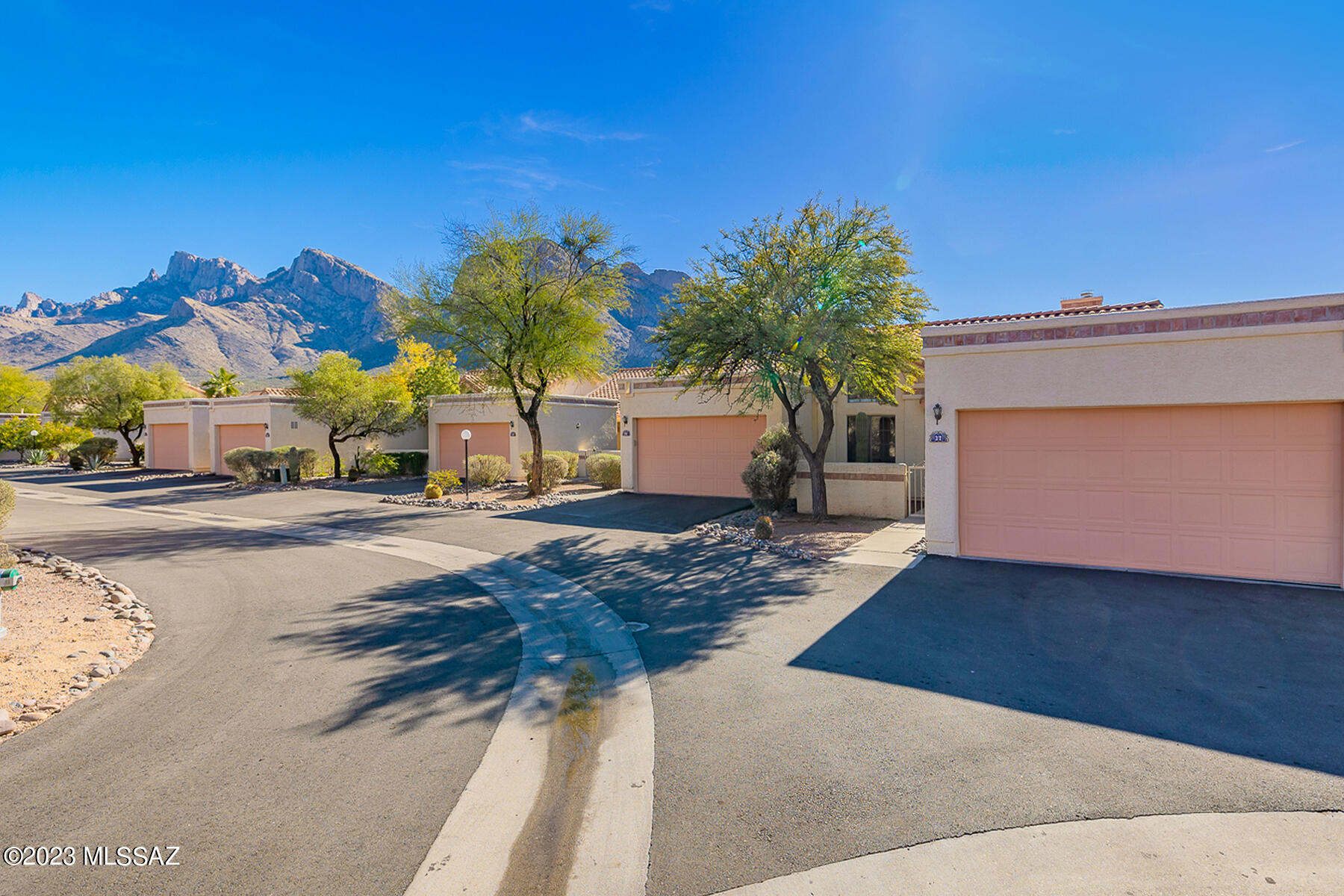 Charming 3 bed/ 2 bath (1140 SqFt) unit near Oro Valley CC and El Conquistador Resort w/ mountain views & open space behind. Light & bright split plan w/soaring ceilings, fireplace and tile floors throughout. Large eat in kitchen with small patio off the kitchen nook. The third bedroom has its own access to the private rear patio w/natural desert & amazing Pusch Ridge Views! Two-car attached garage. The HOA amenities include pool, spa, clubhouse, roof maintenance, exterior painting, trash and pest/termite treatment. Perfect Oro Valley location is convenient to shopping & restaurants.