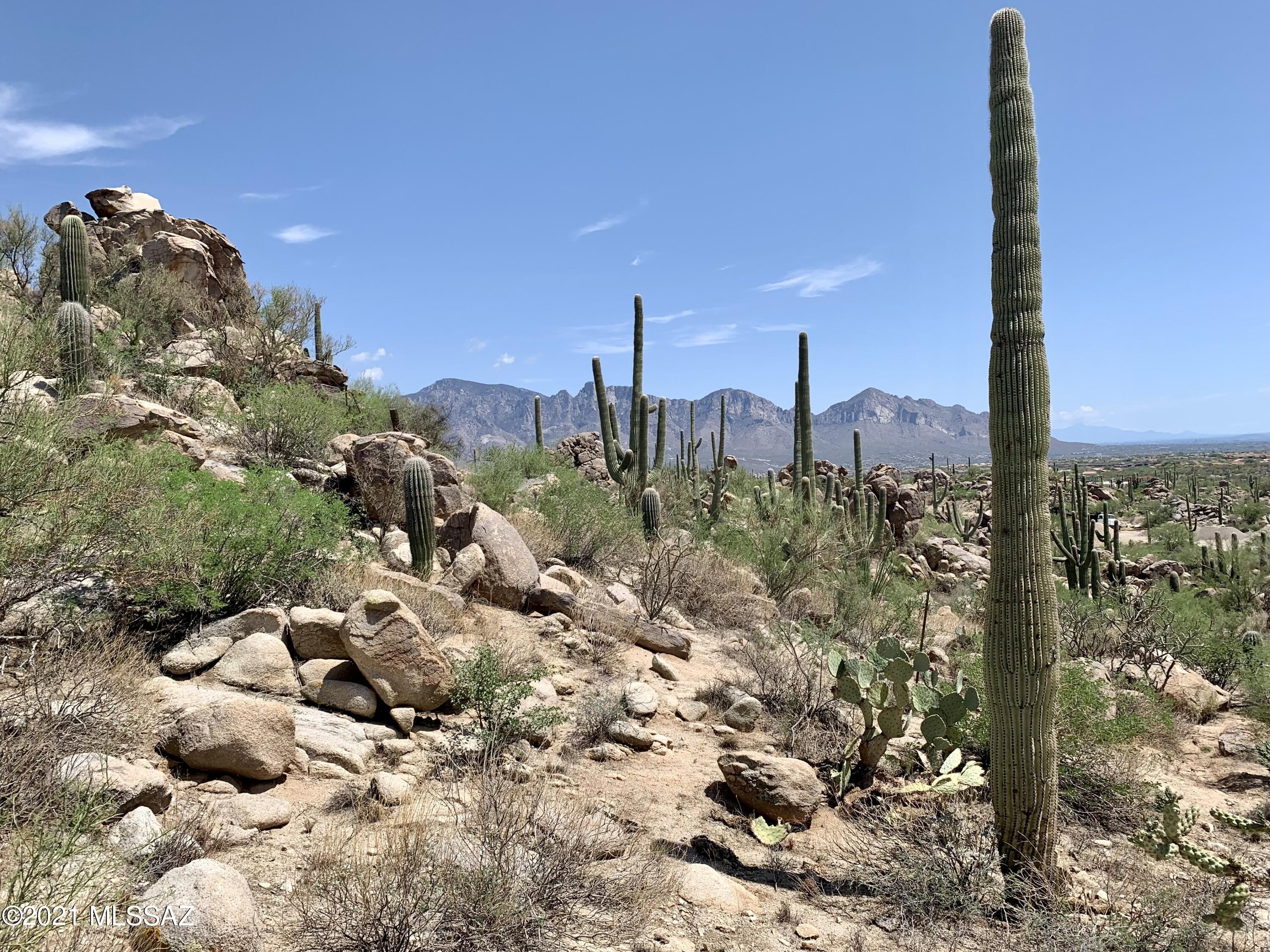 Breathtaking Panoramic Views!!!  This 2.36 acre lot is perched high on the hill creating a spectacular homesite that overlooks the entire valley!  To the east you have magnificent views of the Catalina Mtns and to the south you have sparkling views of Downtown Tucson.   The views don't stop there... it also offers sweeping views of the Tortolita Mtn views creating an impressive portrait every where you look. Tucked behind the gates of Oro Valley's most prestigious golf communities, Stone Canyon.  Consistently ranked in the top 100 for residential golf courses in the nation!
