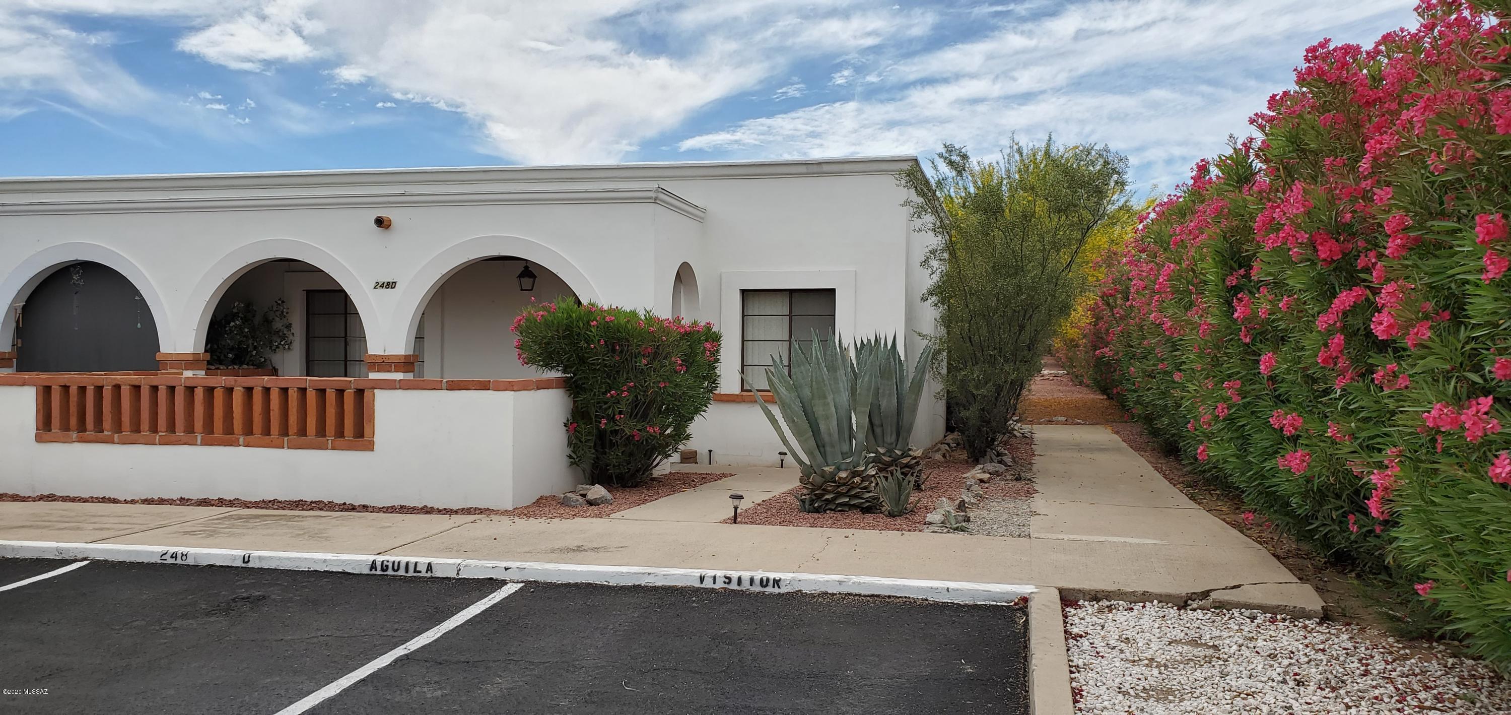 White Arched Villa with all new interior paint and baseboard. Nice 2 bedroom villa with great rental history includes  Washer and dryer. End unit with front row parking.
