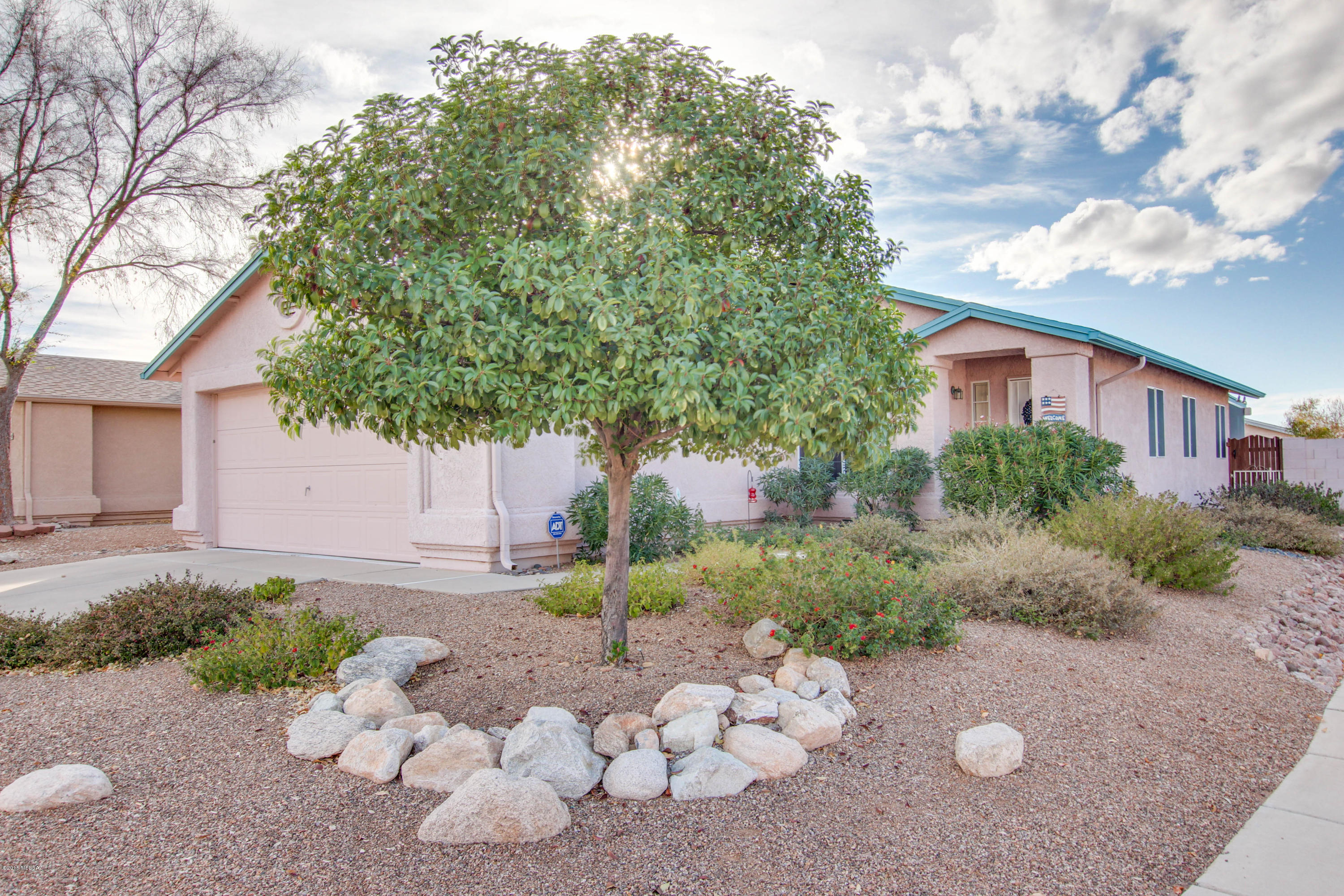 Charming 2 bedroom 2 bath plus den, resting on a large corner lot. Great Eastside location in quiet neighborhood.  Spacious and open floor plan with vaulted ceilings! All New Carpet, Freshly painted and ceiling fans in every room.  Spacious master suite with built-in shelves and French doors that lead to the backyard. Plush grass area in Springtime. Updated window screens and patio/Arizona room. Other features include Cabinets in the garage for extra storage space,  Newer roof, newer Lennox 19 Seer Split system with 2018 Spring/fall HVAC ''check up'' paid. Clear termite inspection (2017) American Home Shield Home Warranty Included. This home is a must see!