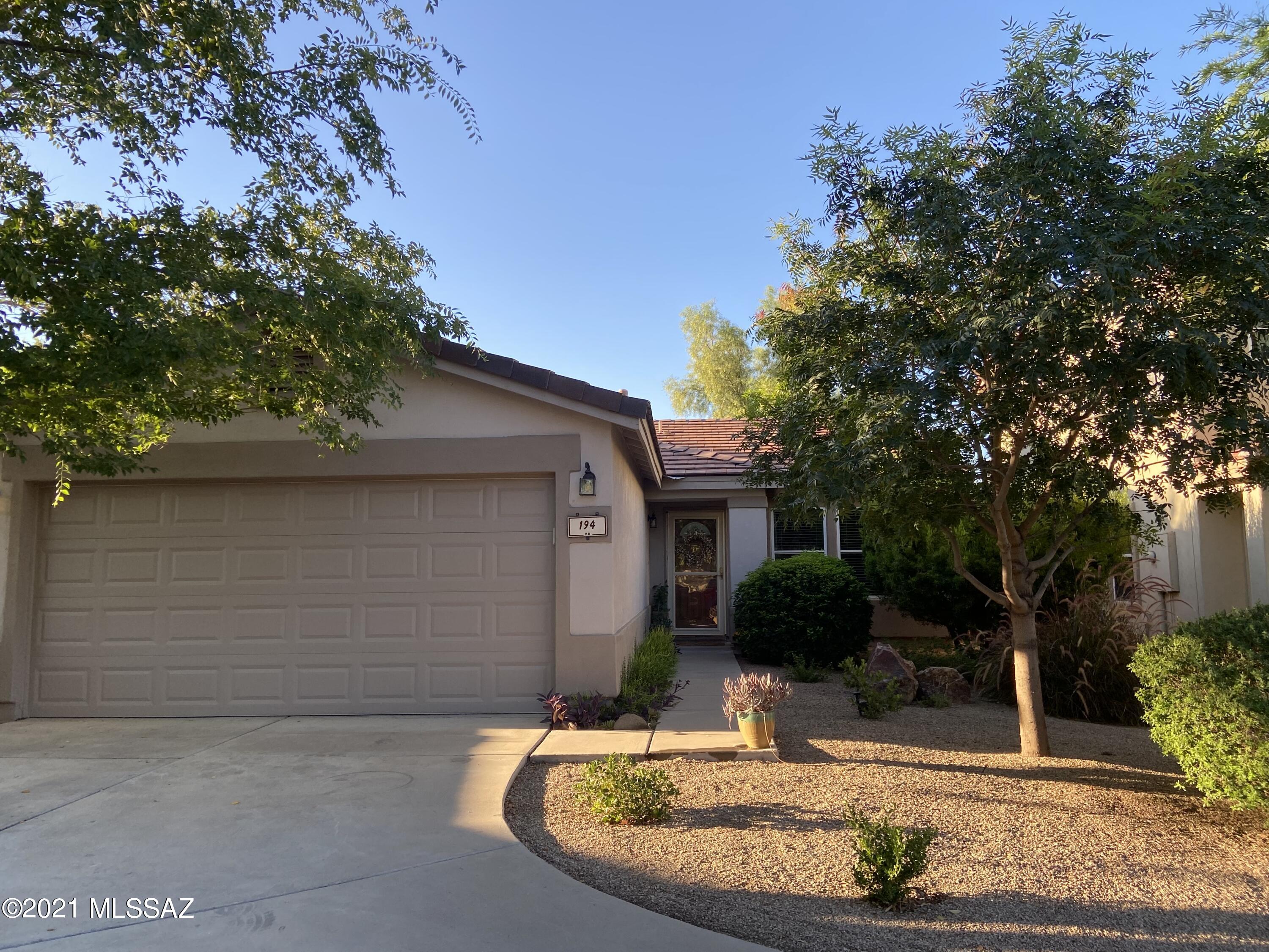 Super clean move in ready home in the heart of Rancho Sahuarita! Enjoy everything this community has to offer including lakes, community center, parks, pool, gym, sport courts & more! Wide open floor plan with no carpet! Eat in kitchen includes and island and plenty of storage.  The lush backyard includes a full length porch, south facing privacy and tons of trees, plants and greenery to enjoy. Make this home yours today!!