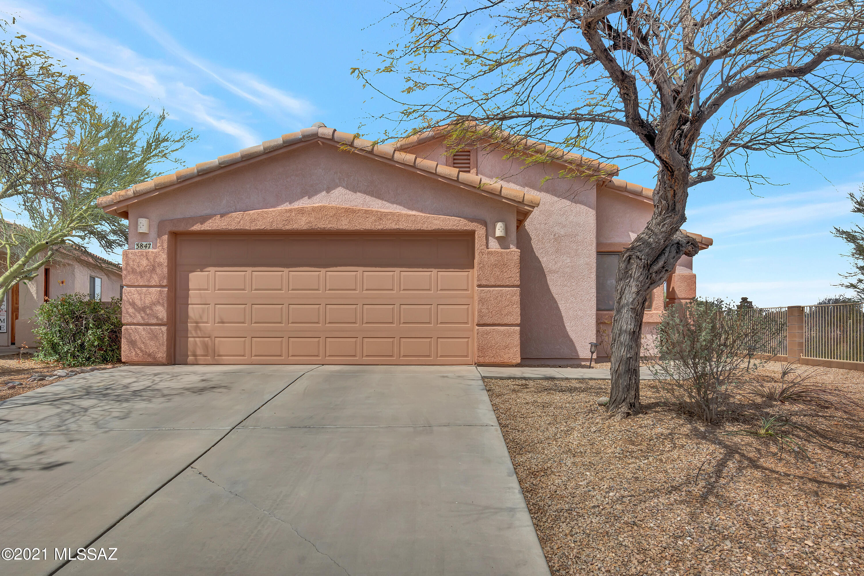Welcome to Rancho Agua Dulce Community!  This home is located in a gated community in much desired Westside Tucson.  It is sitting on almost 0.3 Acres elevated premium lot on a Cul-De-Sac with mountain views and much deserved privacy!  This beautiful home offers  4 bedroom/2 bathrooms, split bedroom floor plan, and NO CARPET!  Very spacious master bedroom & master bathroom with double vanity, garden tub, walking closet and much more.  Open kitchen welcome you with maple cabinets, corian counter tops, stainless steel appliances with gas stove! Enjoy the extended covered back patio with great mountain view and looking over the wash below and acres of common area.  Gated community offers walking trails, community pool and playground.  Come and see it today to make this ''Must See'' home yours