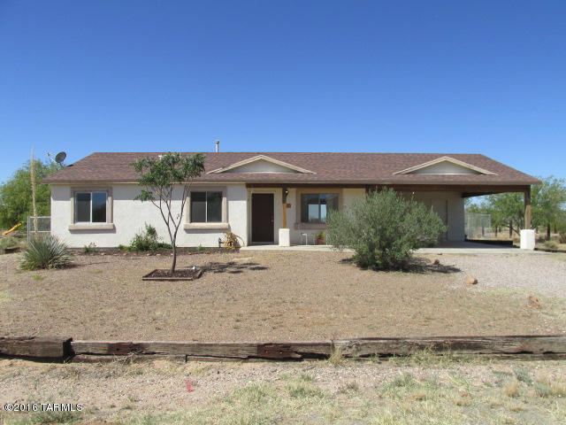 Away from the city! Peaceful setting! Gorgeous Tucson sunsets! Awesome mountain views! Clear nights under the stars! Not far from Old Tucson and the Desert Museum! Just under an acre on a paved road this well maintained home boasts an open floor plan, new paint and new flooring. True country living! Make this cute ranch style home your very own ''Home on the Range'' where the wildlife roams!