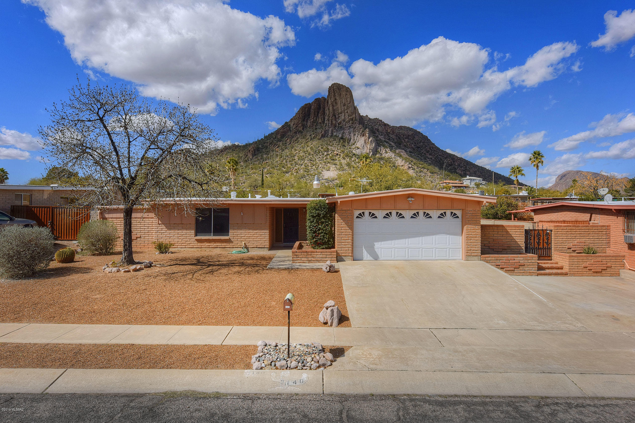 Awesome home with large layout with formal living and dining room!  Family room has cozy fireplace attached to kitchen which boast breakfast bar and plenty of cabinets.  Full length covered patio with deep pool and tons of storage with storage shed.  2 car garage with storage and extra parking on side of home.  All of this without a HOA and spectacular mountain views!!