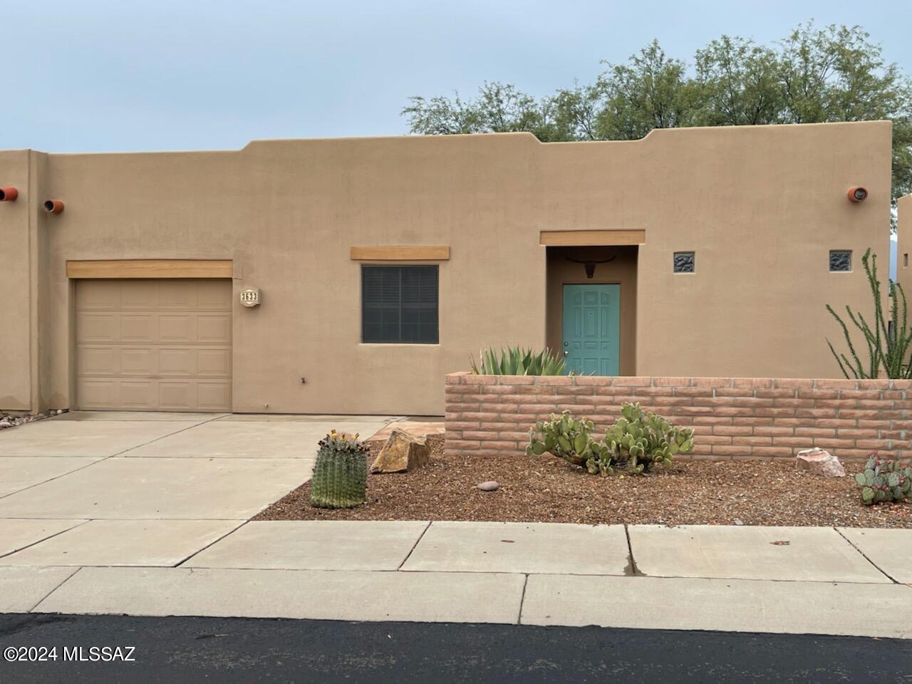 You won't want to miss this stunning 2bed/2bath townhome located in the coveted gated Santa Rita Springs 55+ community in Green Valley! Split floor plan boasts two bedroom suites and spacious great room with wonderful natural lighting. Main suite is complete with walk-in shower and huge walk-in closet. 2nd suite includes a full bath too! Galley kitchen with granite counters and plenty of cabinet space. Beautiful Travertine tile throughout. Relax under the covered patio with extended flagstone in backyard and enjoy the mountain views. Membership to the GVR included which means access to all the amazing amenities offered - tennis courts, community pool and spa, racquet ball, fitness center, walking trails, social clubs and events. The list is endless! W/D included for convenience.