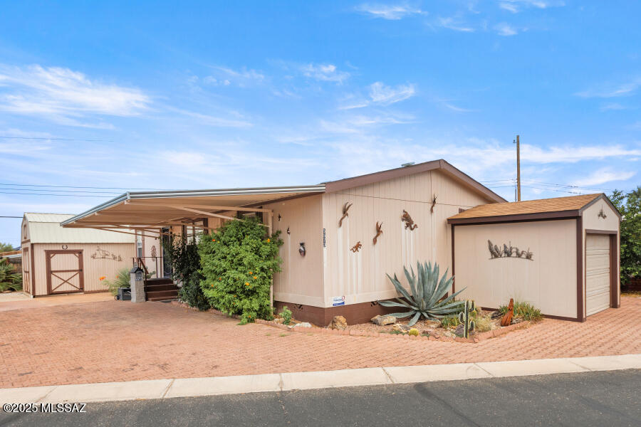 Beautiful newer 2012 Cavco, fully furnished, great mountain views, cantilevered carport awning, and paver driveway. There is a private seating area on the west side of home. This home also includes a large workshop in the back and a golf cart garage with electric garage door opener. Open floor plan inside with split bedroom floor plan. Flooring is luxury vinyl wood-look planking. Kitchen and bath counter tops are granite. Kitchen has nice soft toned wood cabinets. The HOA fee in this 55+ community includes unlimited golf, tennis, pickle ball, shuffleboard, pools, spa, exercise room, trash collection, and much more. You own the land!