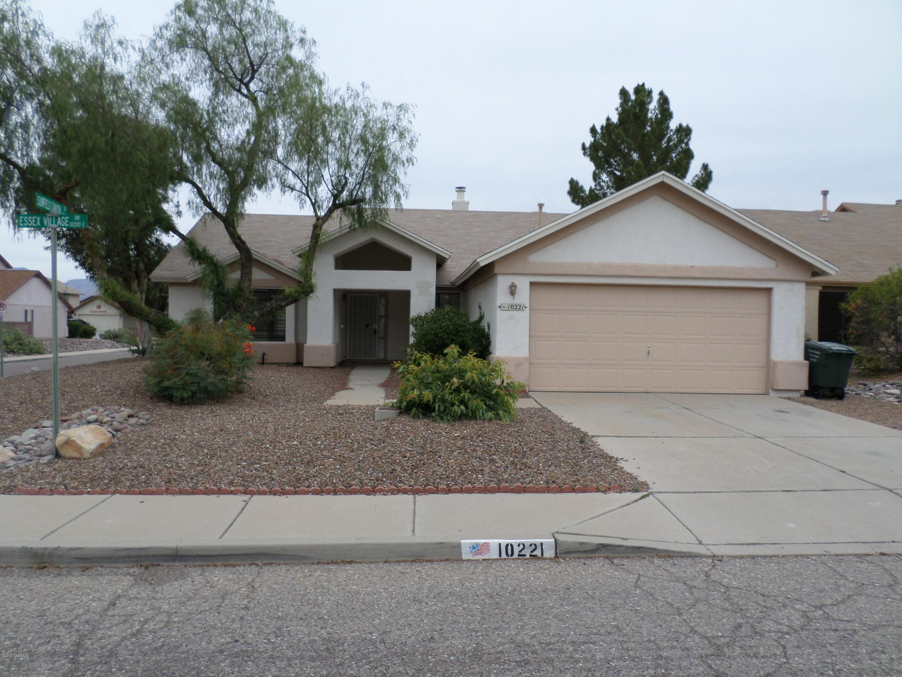 Wonderful 3/2 with fireplace in desirable East Tucson. Spacious floor plan with newer tile and paint, ceiling fans, neutral palette. Formal living and dining rooms, eat in kitchen with breakfast bar and stainless appliances. Newly remodeled baths and brand new HVAC system, corner home and 2 car garage. Backyard offers a North facing covered patio with low care landscape.