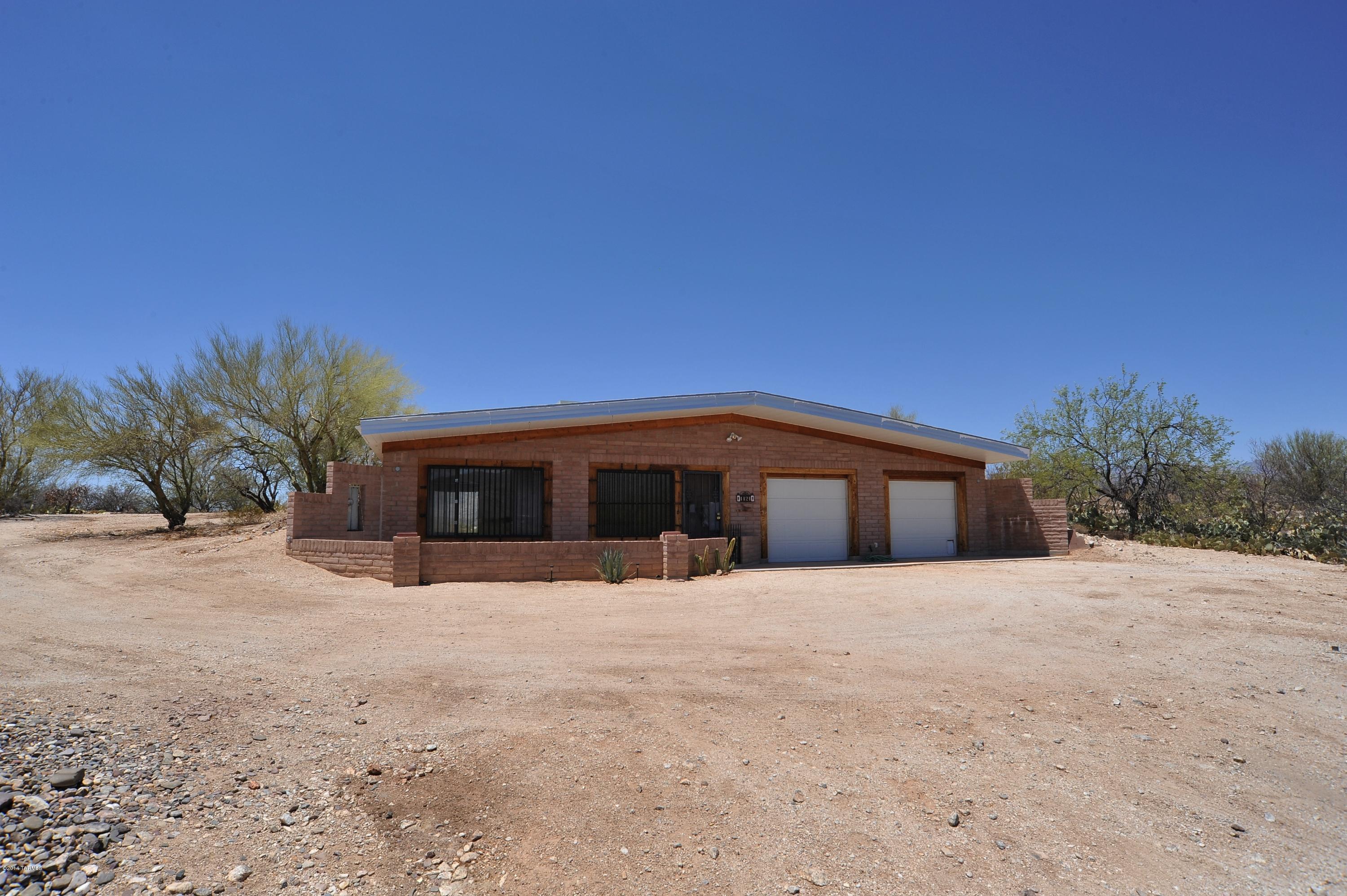 Remarkable opportunity. Great lot with GUEST HOUSE ONLY! Estate Sale. Owner built a very nice guest house with plans to later build his dream home on 3.34 acres! Never started on the main home but built a very sturdy guest house with single bedroom plus living area and a large oversized 2 car garage/workshop!  Fantastic Rincon and Catalina Mountain Views.  Nice patio.  All waiting for you. This would make a perfect get-away home for a Winter Resident! Great privacy!  And room for horses too.
