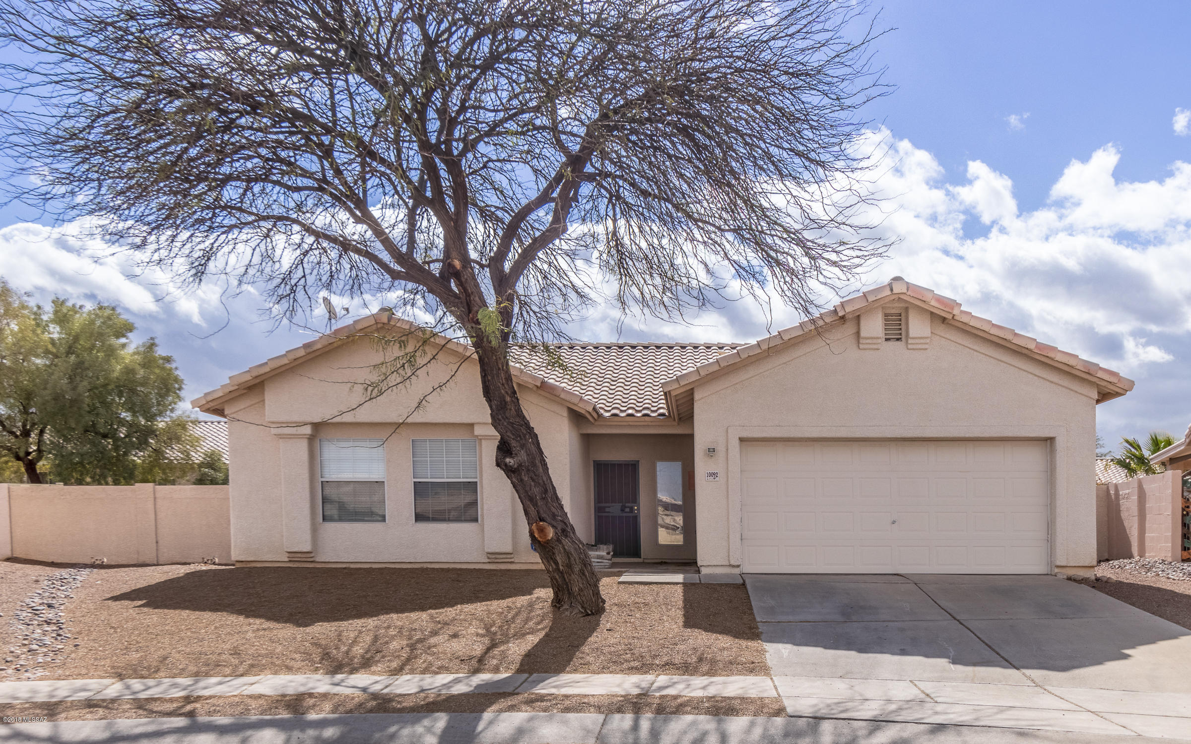 High Vaulted ceilings and foyer welcome you to this 3 bedroom, 2 bath, 1,445 sqft home on a Cul-de-Sac in the friendly Hacienda Del Oro neighborhood. Kitchen boasts a breakfast bar, lots of prep space, pantry closet and popular open concept plan with view of the backyard. Ceiling fans throughout. Relax in the Master bedroom with walk-in closet and ensuite bath with garden tub and dual sinks. Laundry room includes washer and dryer. Outdoor fun awaits you in the fenced backyard with covered patio. Easy care desert landscaping. Your must-have attached 2-car garage. Close to award-winning Vail Schools, shopping, eateries, medical and dental services, NW Emergency Center at Vail, TMC Rincon Medical Center and UA Tech Park. Purple Heart Park sports a dog park, playgrounds, little league fields swimming pool and paved walking paths.